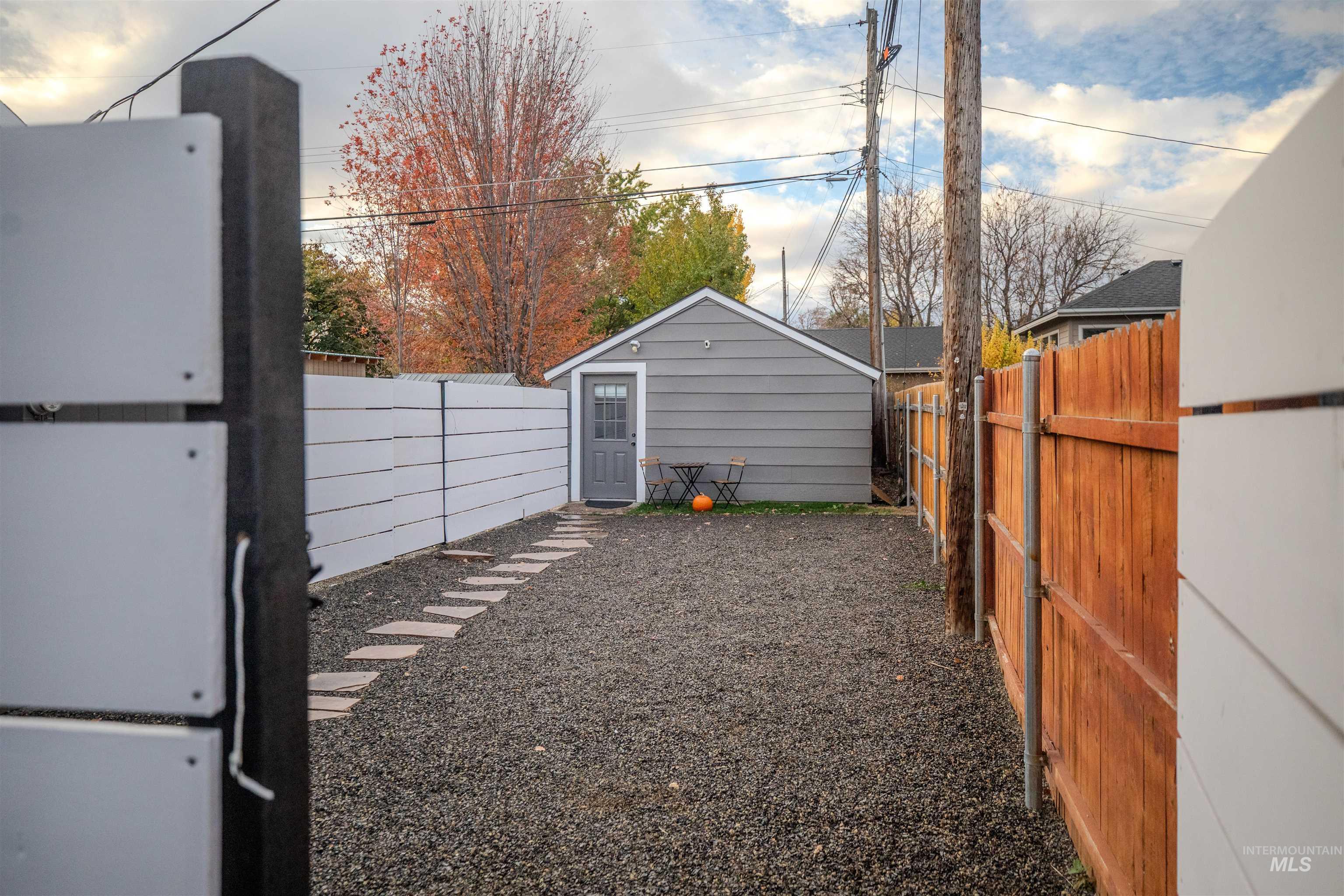 Fenced courtyard at the front of the detached studio unit.