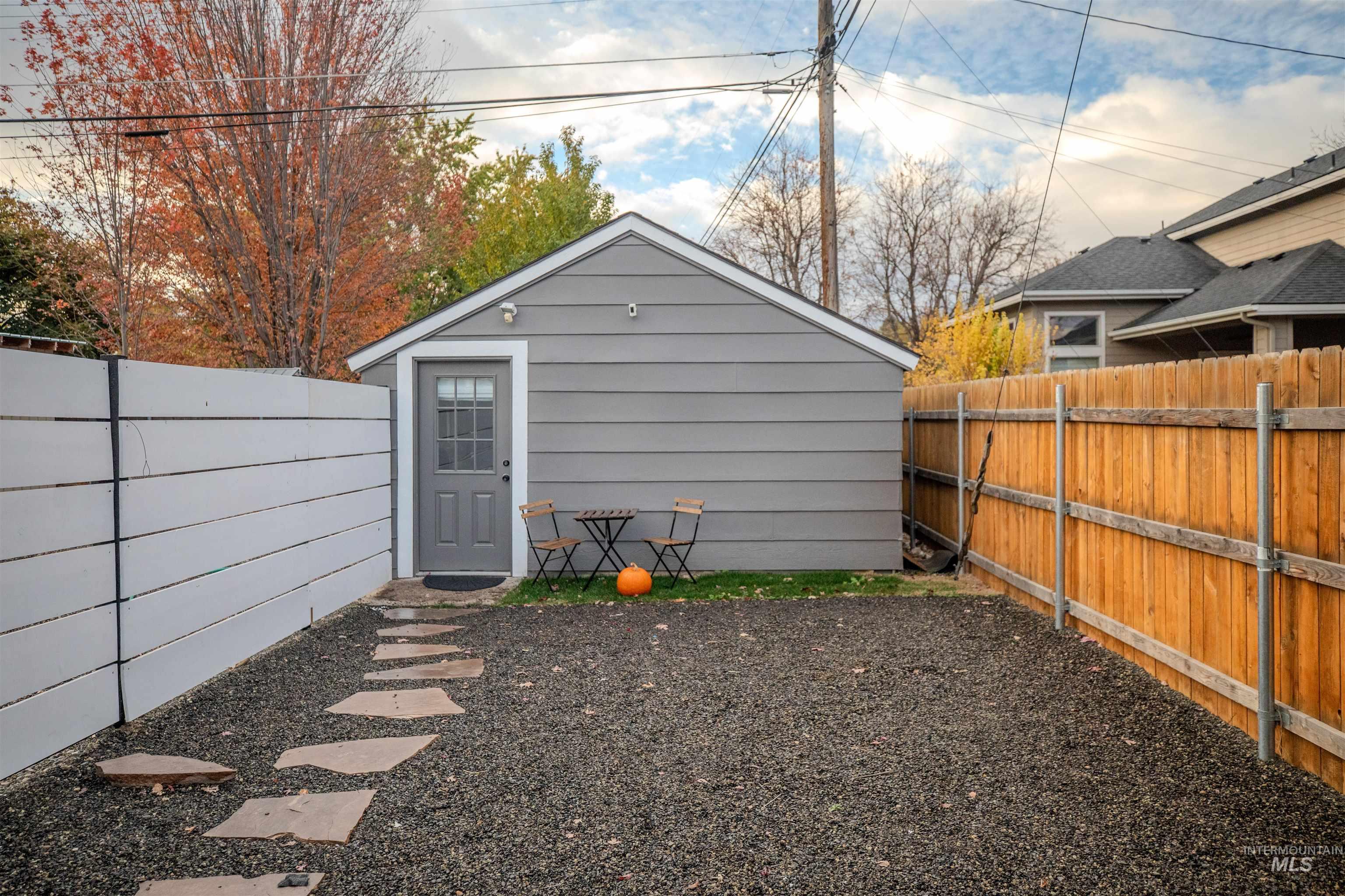 Fenced courtyard at the front of the detached studio unit.