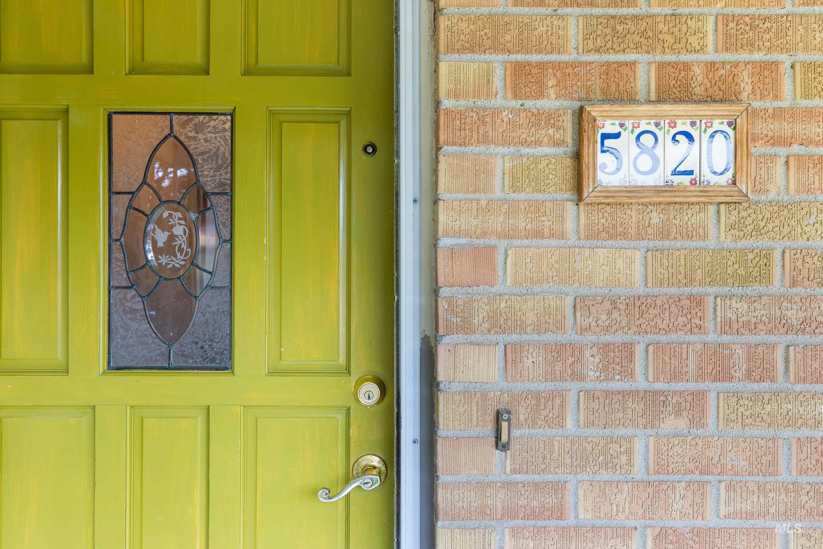 View of exterior entry with board and batten siding