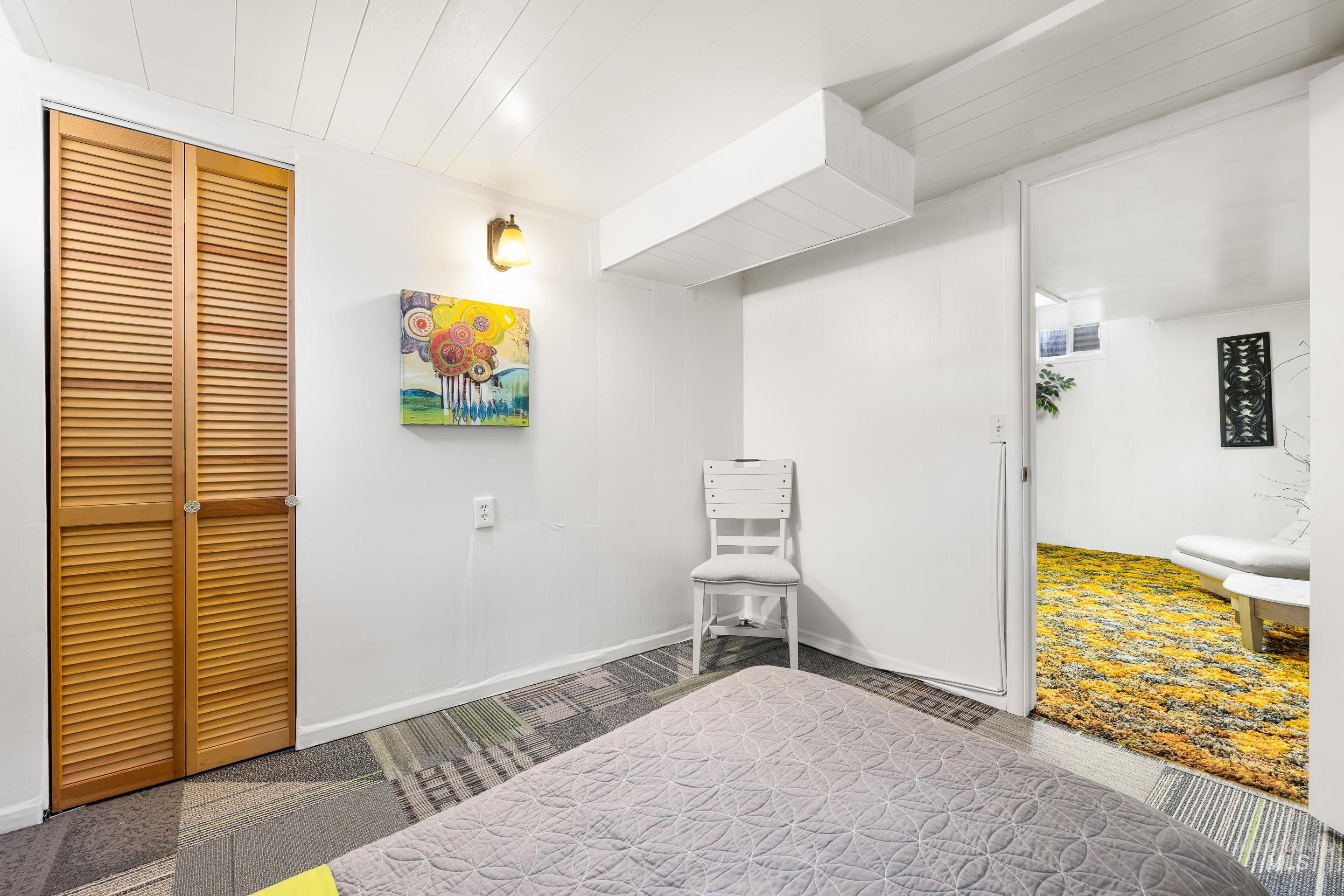 Living area featuring baseboards and carpet floors