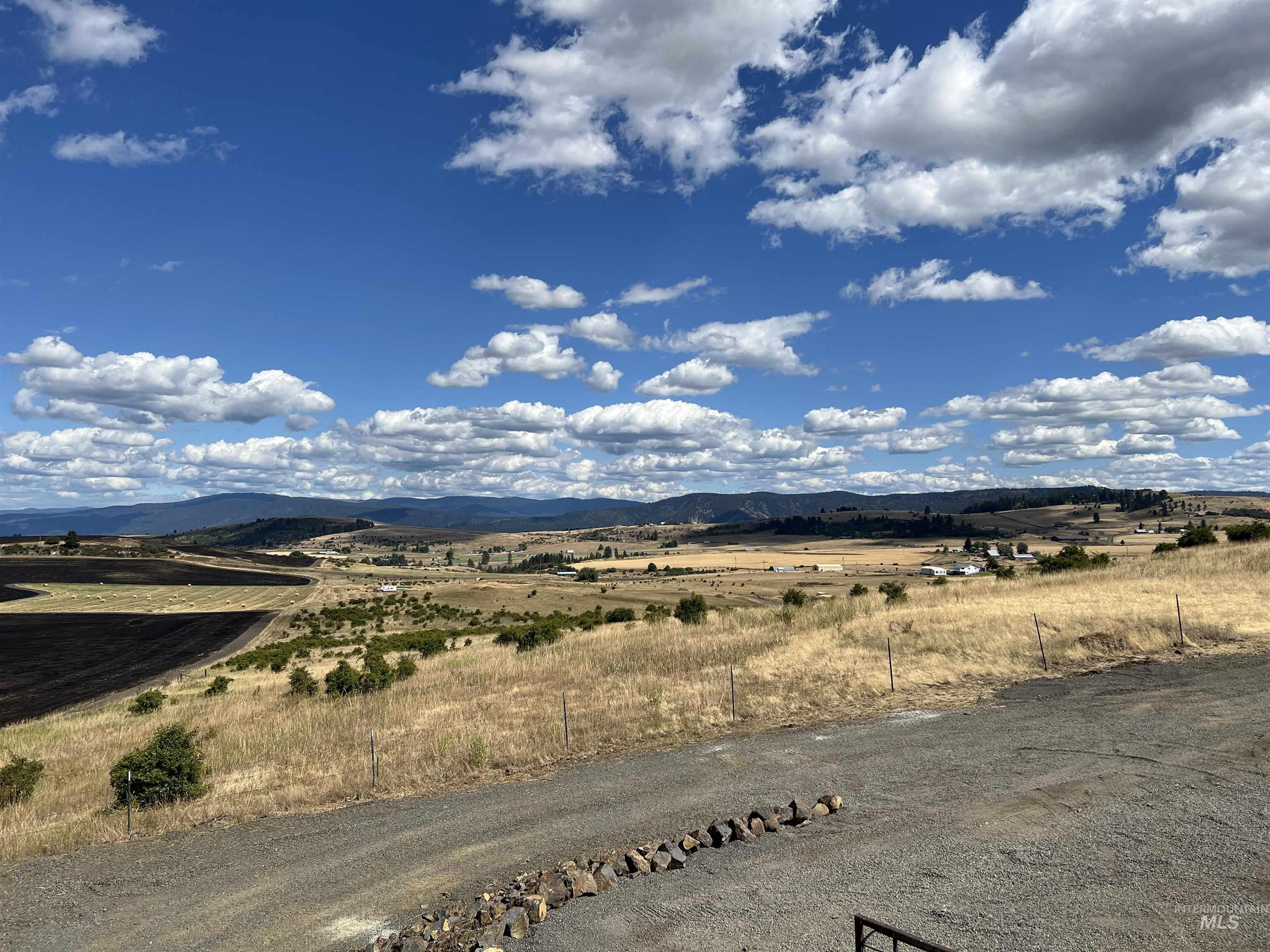 View of mountain backdrop featuring rural landscape