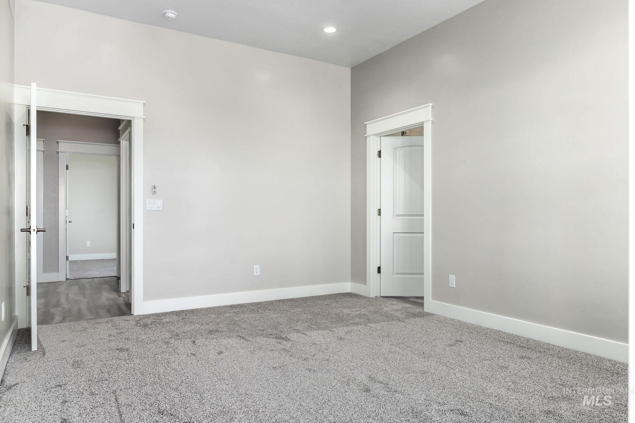 Unfurnished room with carpet floors and recessed lighting