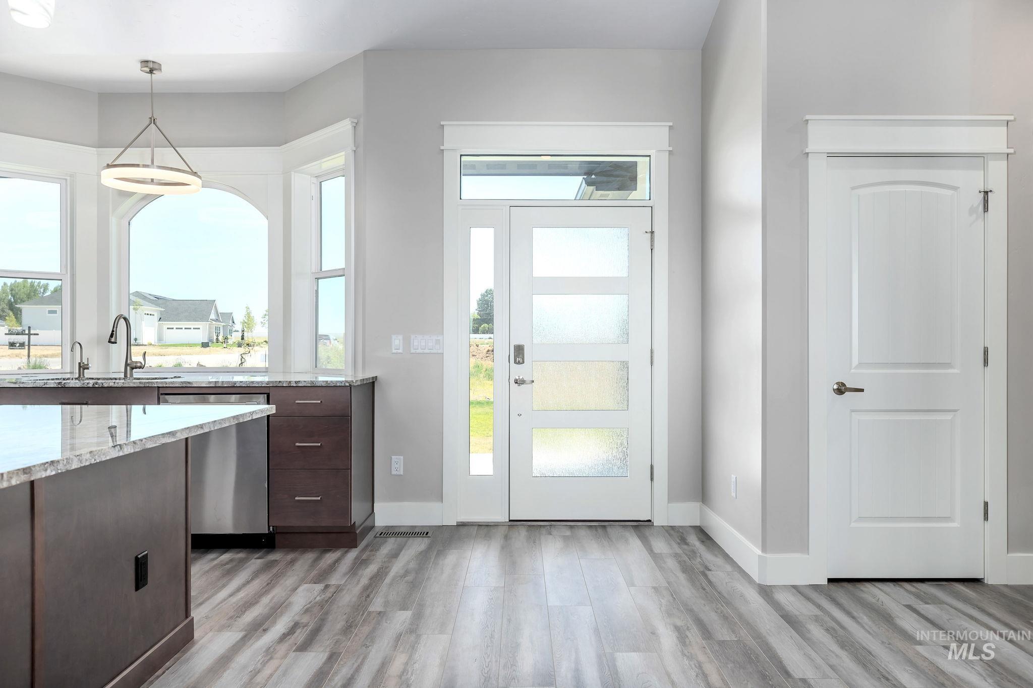 Entrance foyer with light wood finished floors
