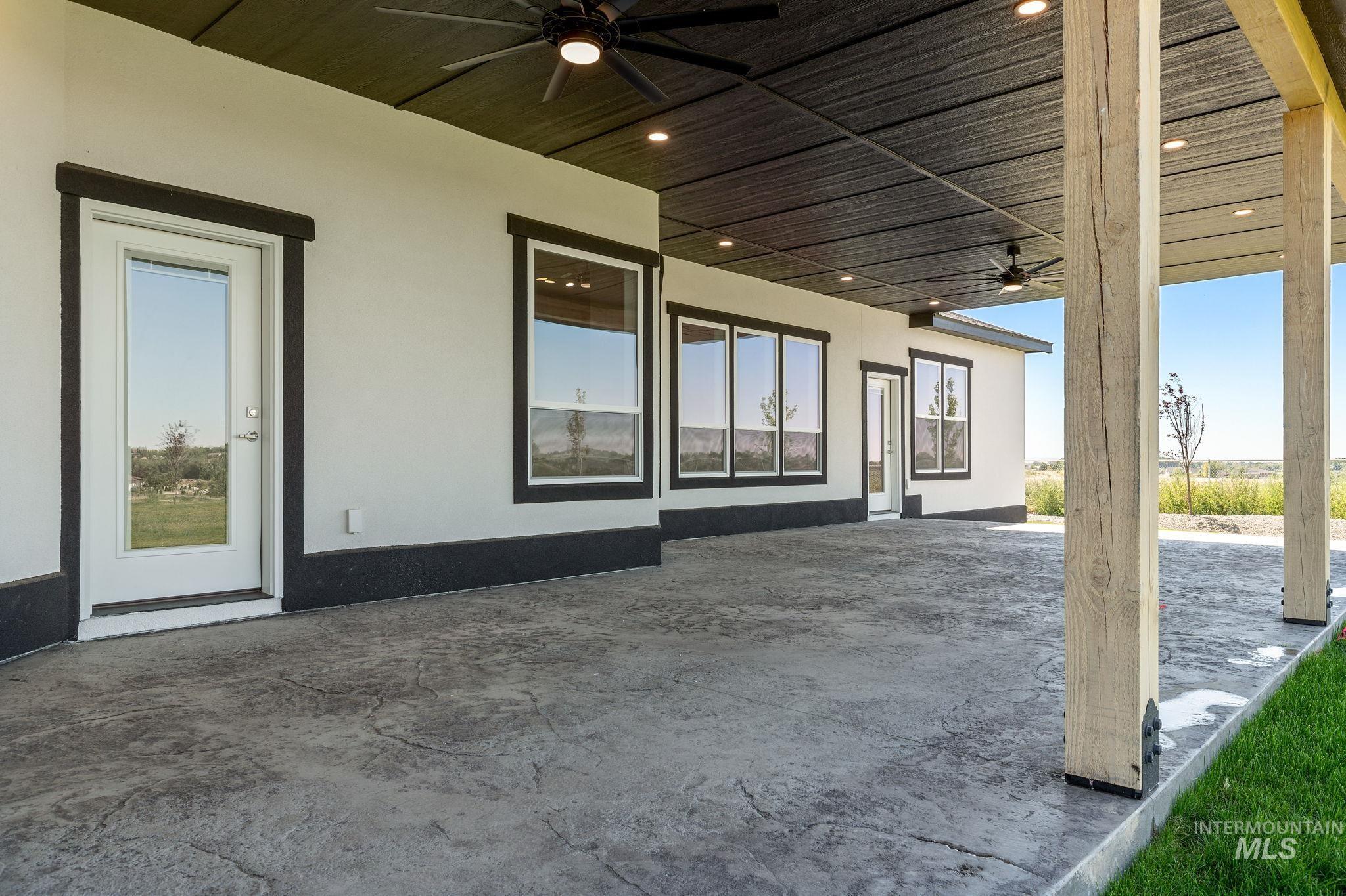 View of patio with a ceiling fan
