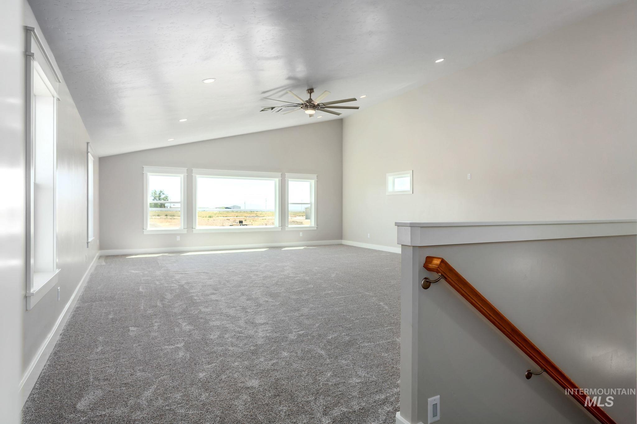 Unfurnished bonus room featuring vaulted ceiling, carpet flooring, ceiling fan, and recessed lighting