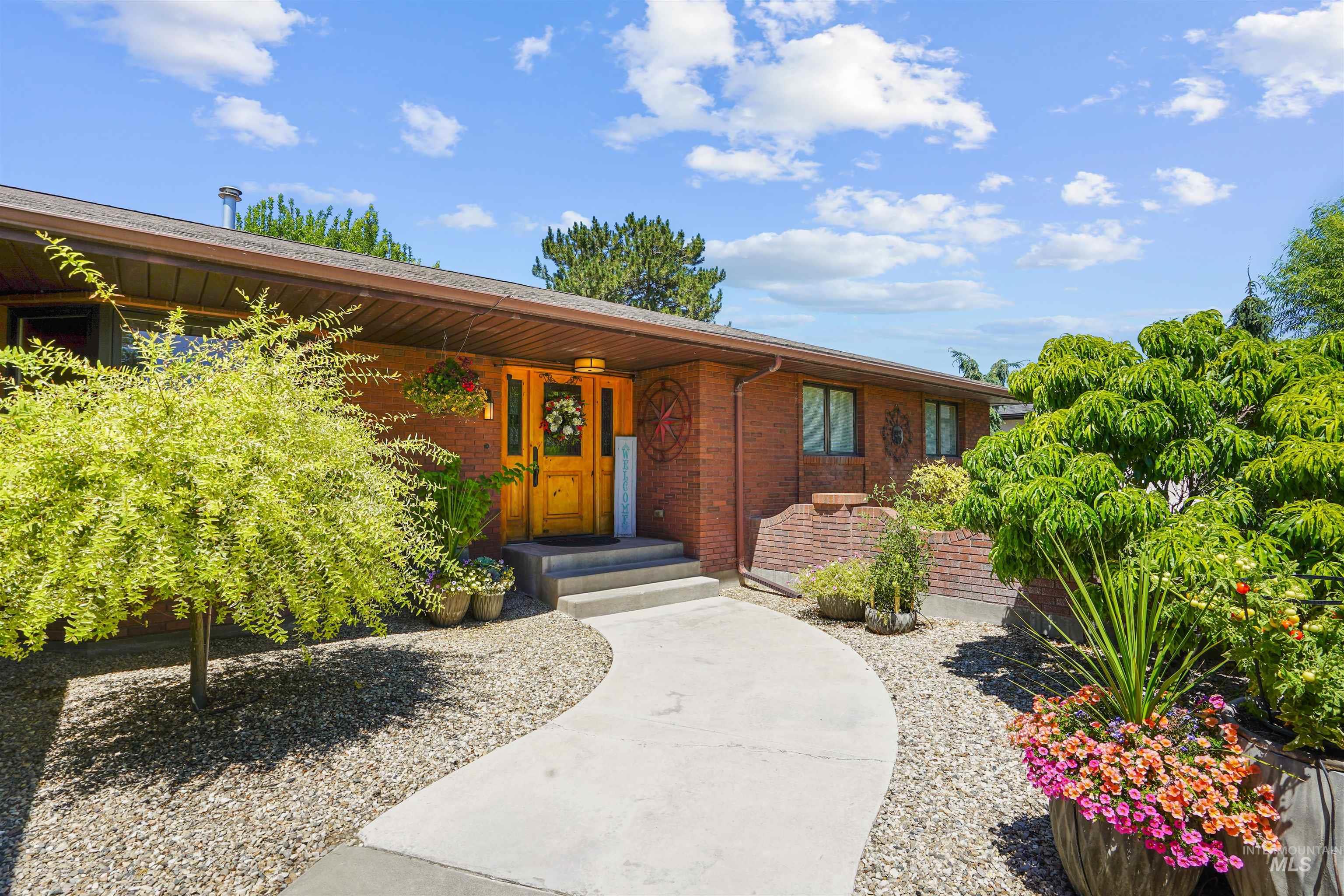 Doorway to property featuring brick siding