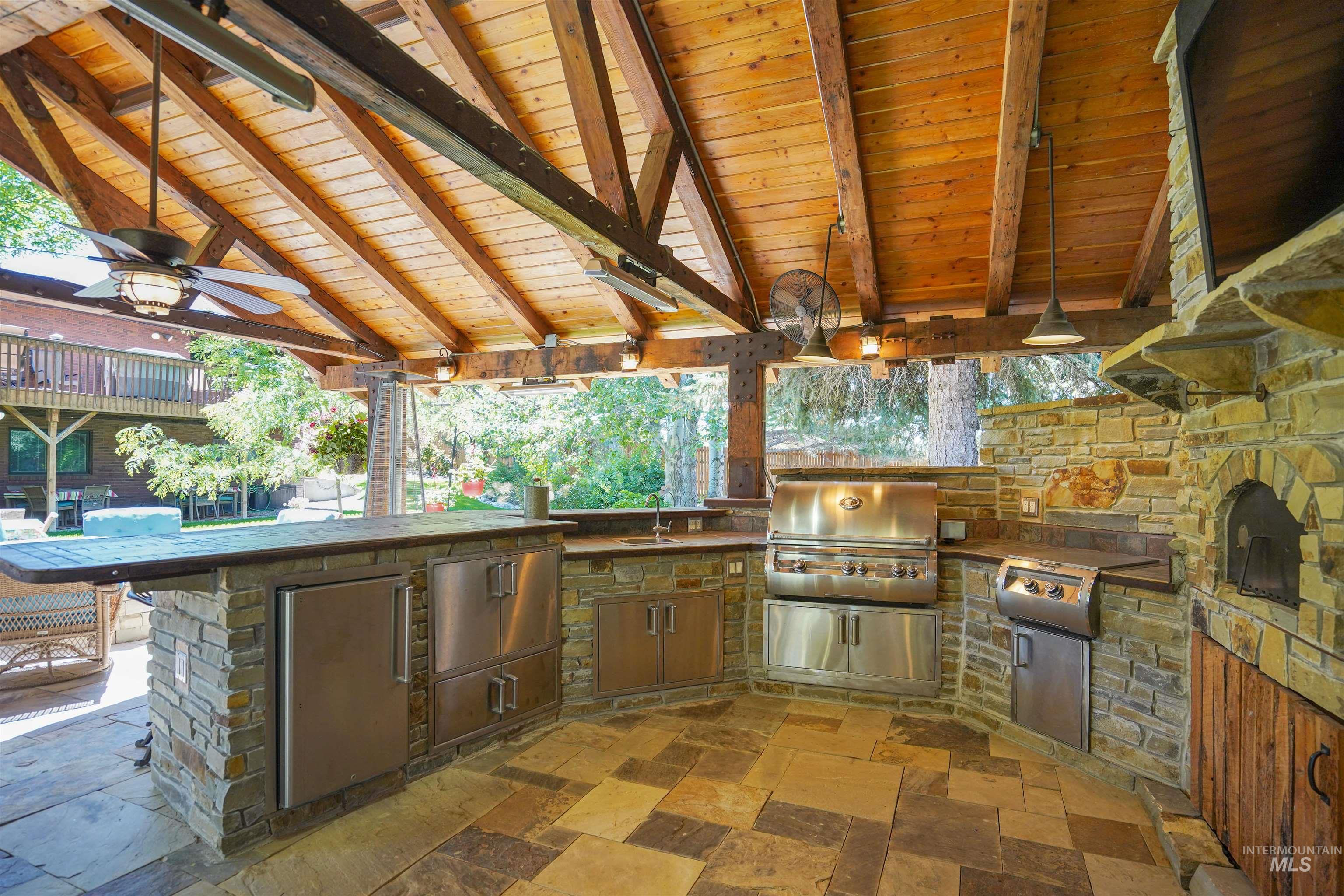 View of patio / terrace featuring ceiling fan and area for grilling