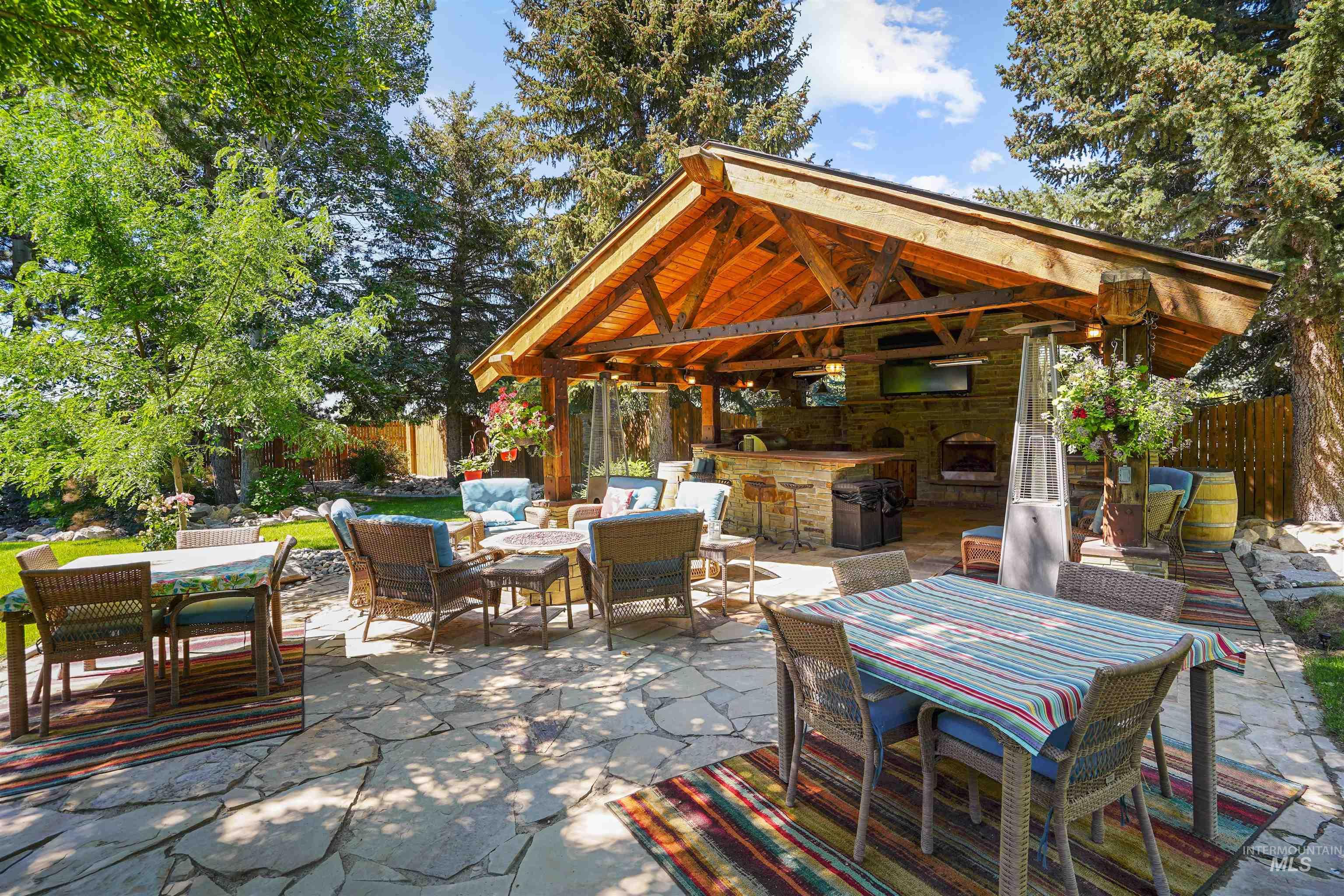 View of patio / terrace featuring a gazebo, outdoor dining space, a grill, and an outdoor living space