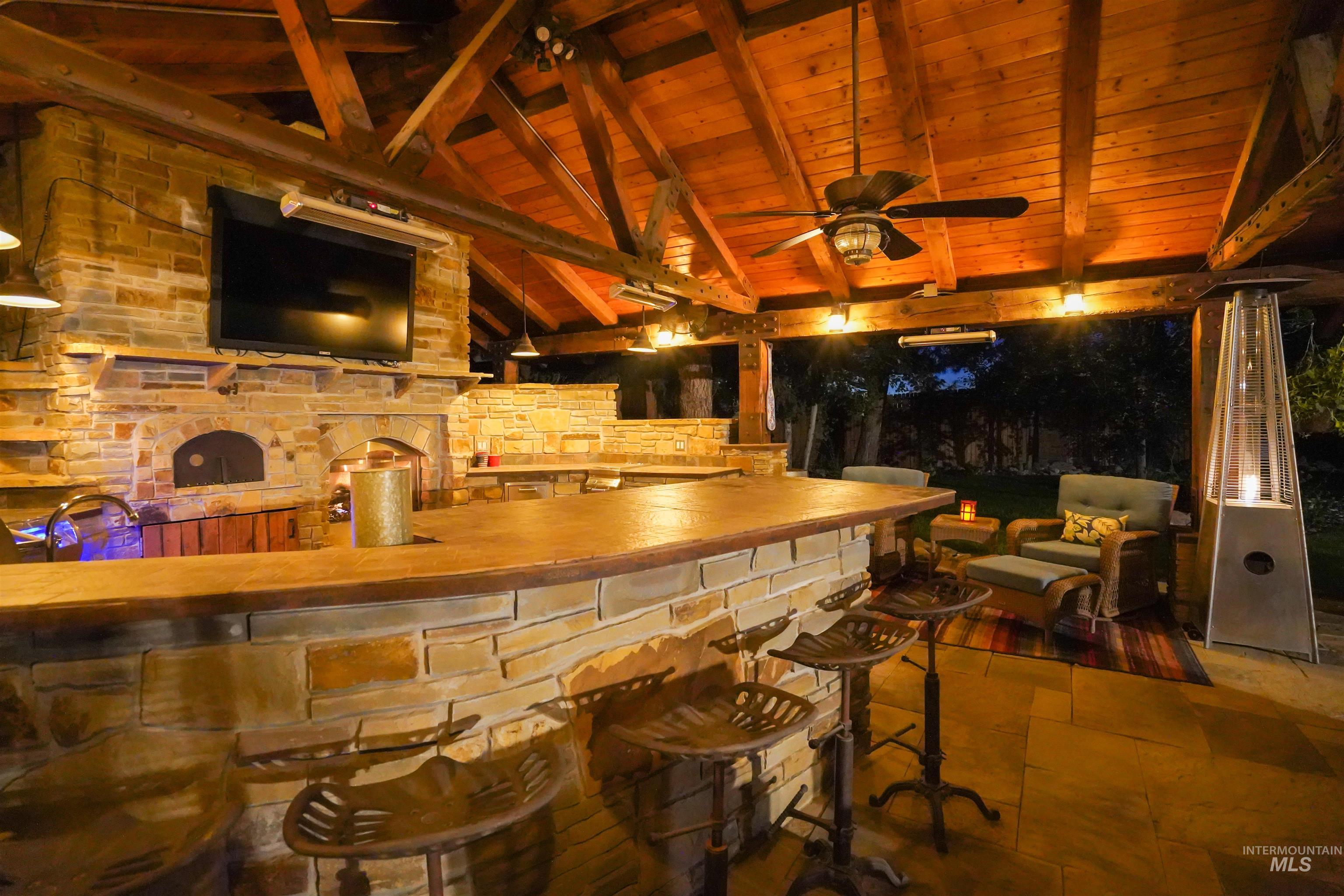 View of patio featuring ceiling fan
