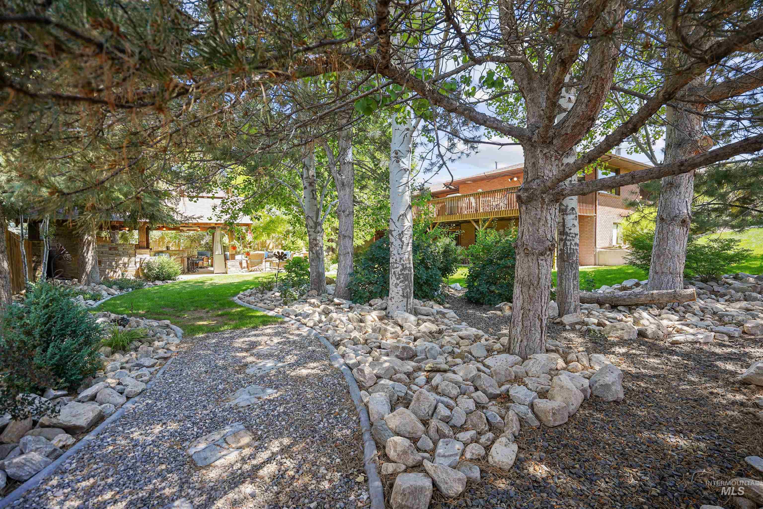 View of yard featuring a patio area and a wooden deck