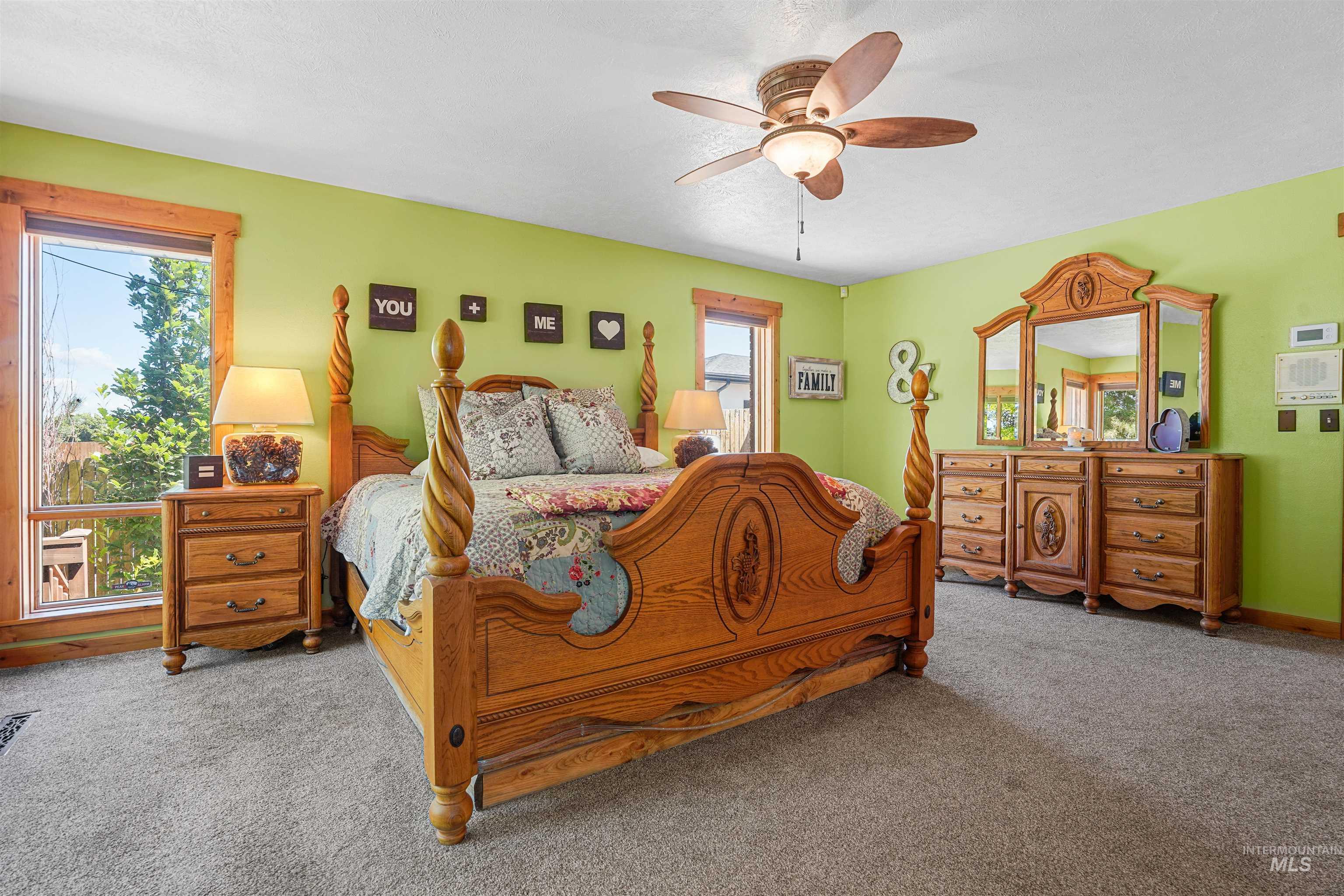 Bedroom featuring carpet floors and a ceiling fan
