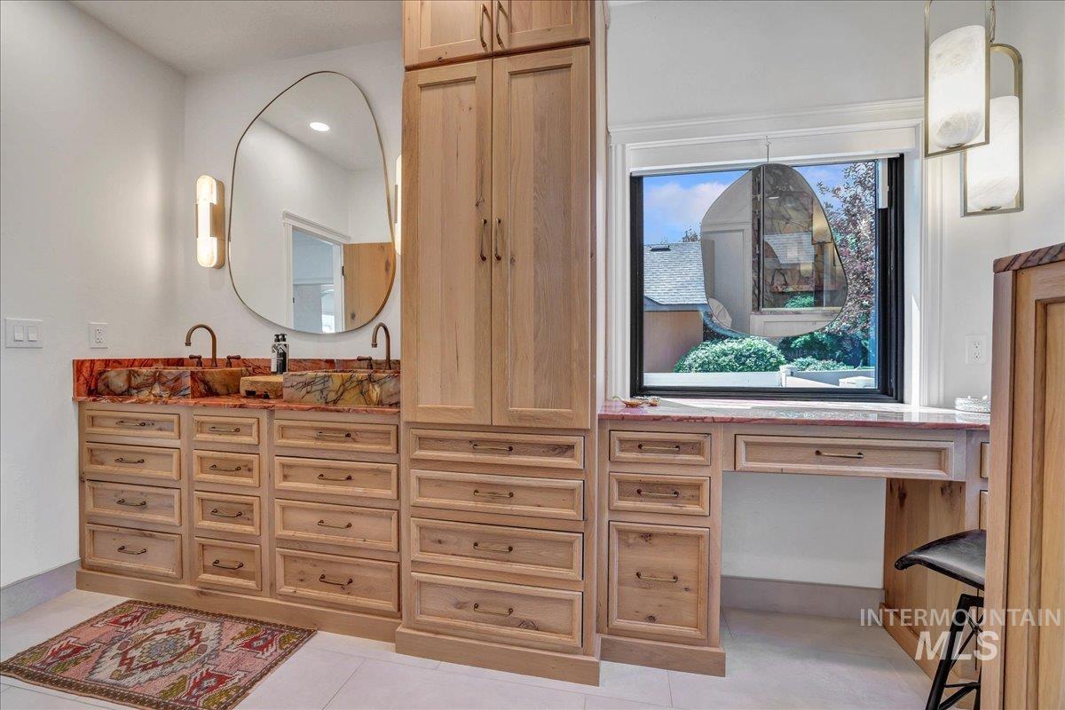 Bathroom with vanity and tile patterned flooring