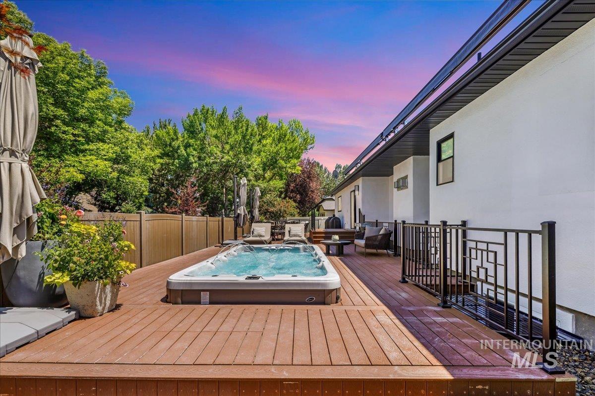 Deck at dusk featuring an outdoor hangout area