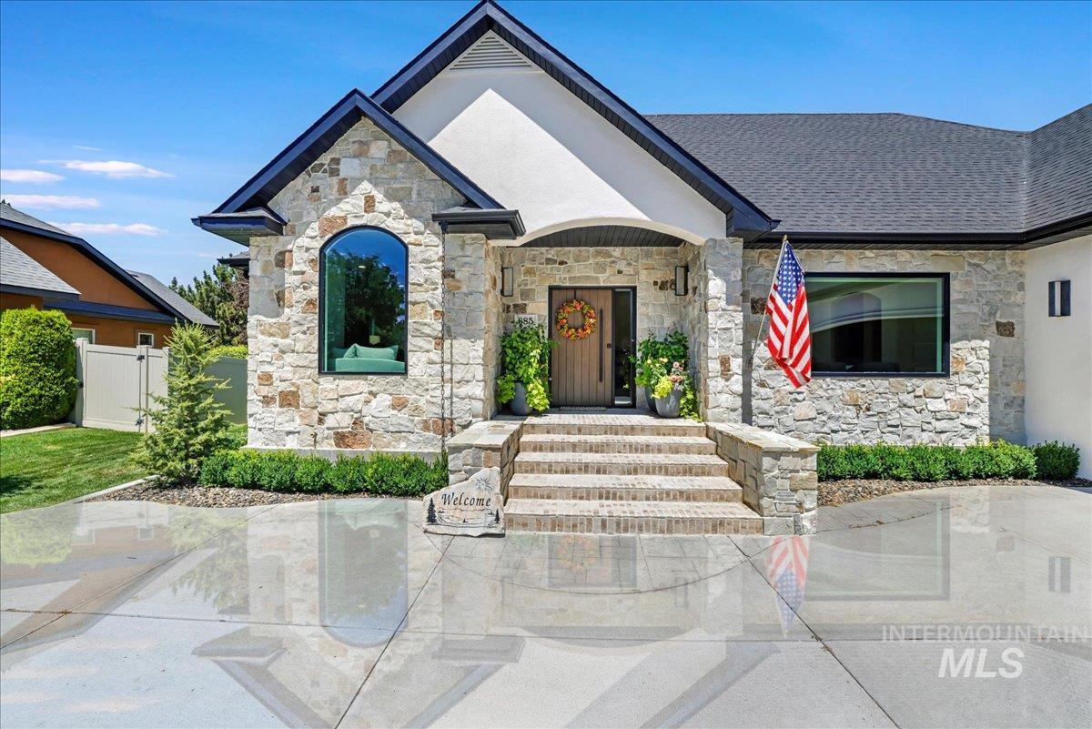 View of front of property with stone siding