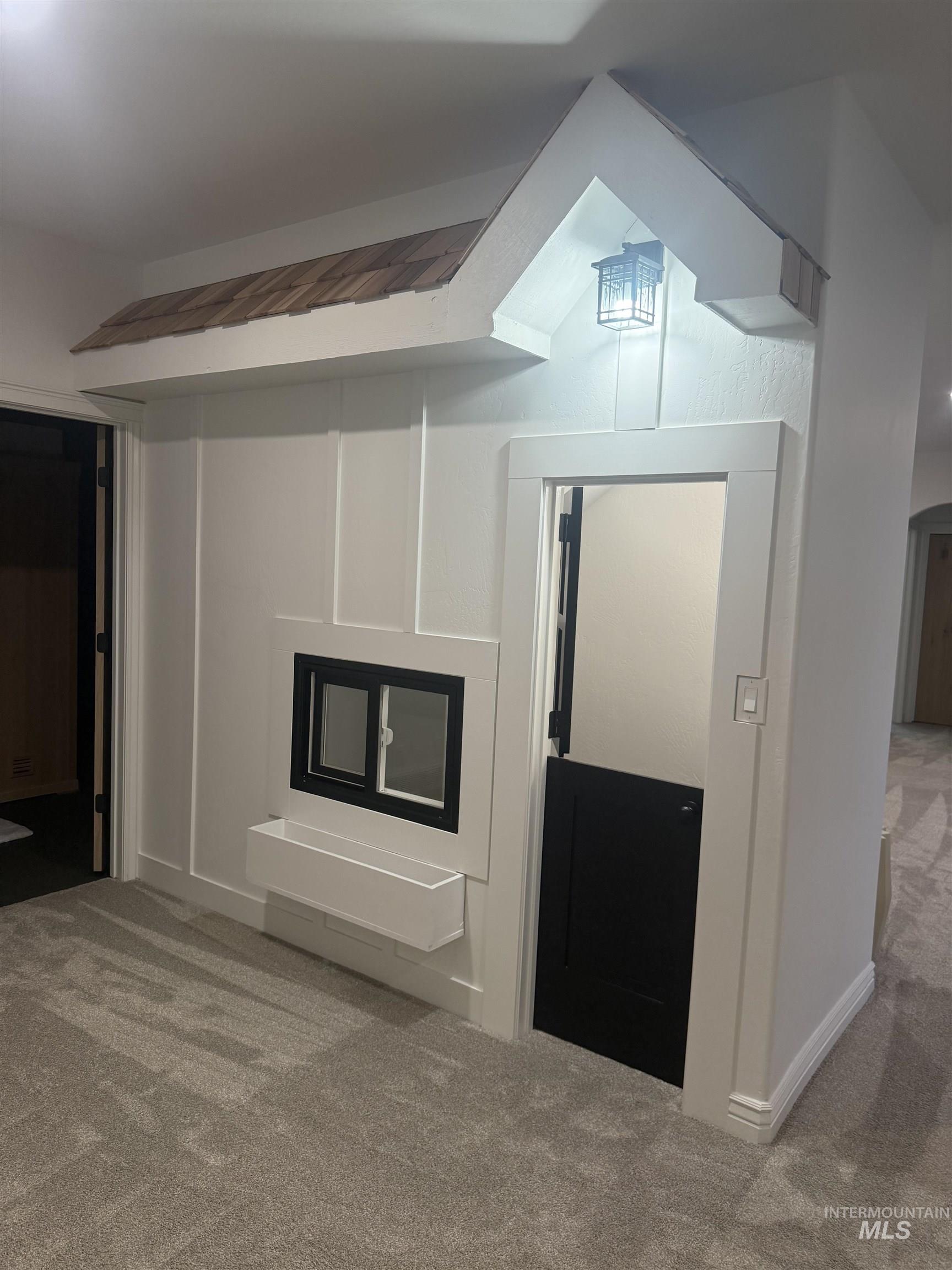 Unfurnished living room with carpet floors