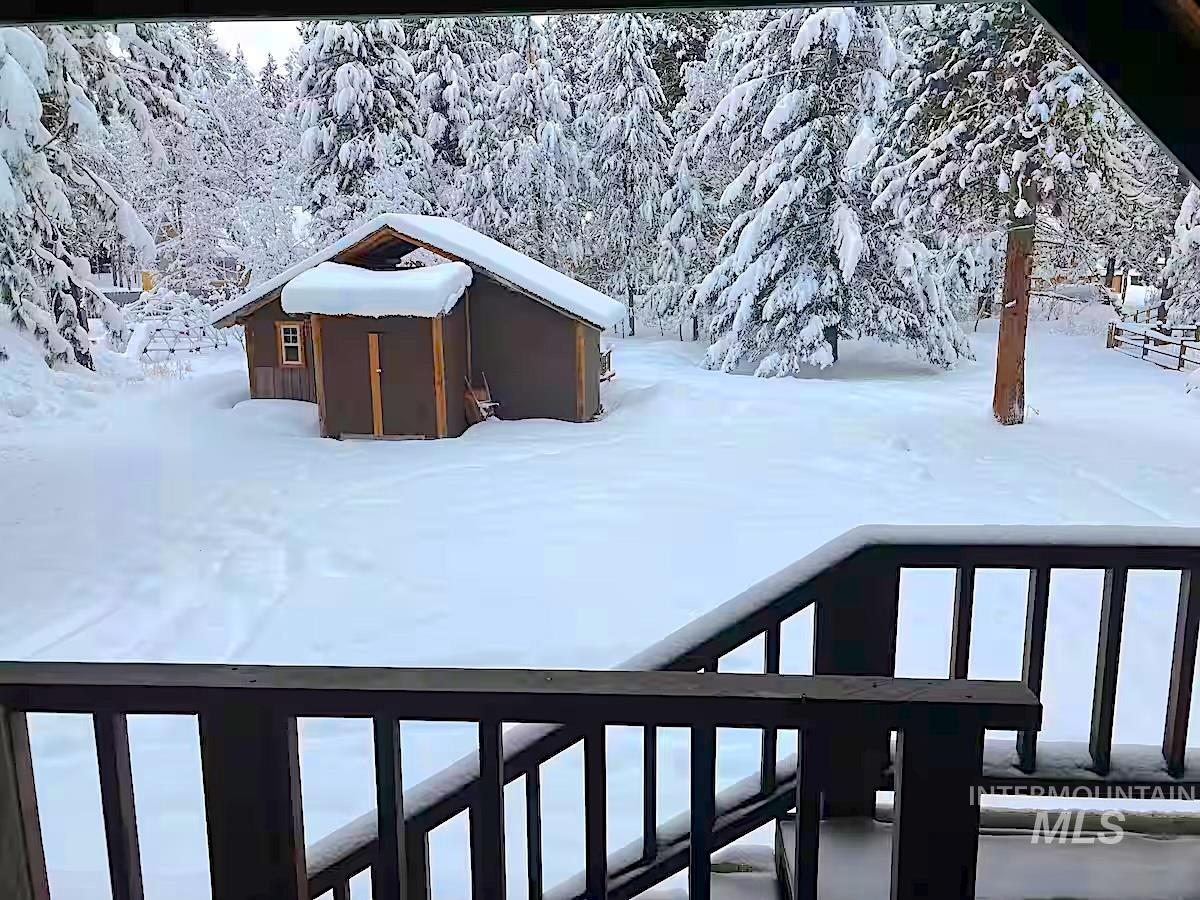 View of yard covered in snow