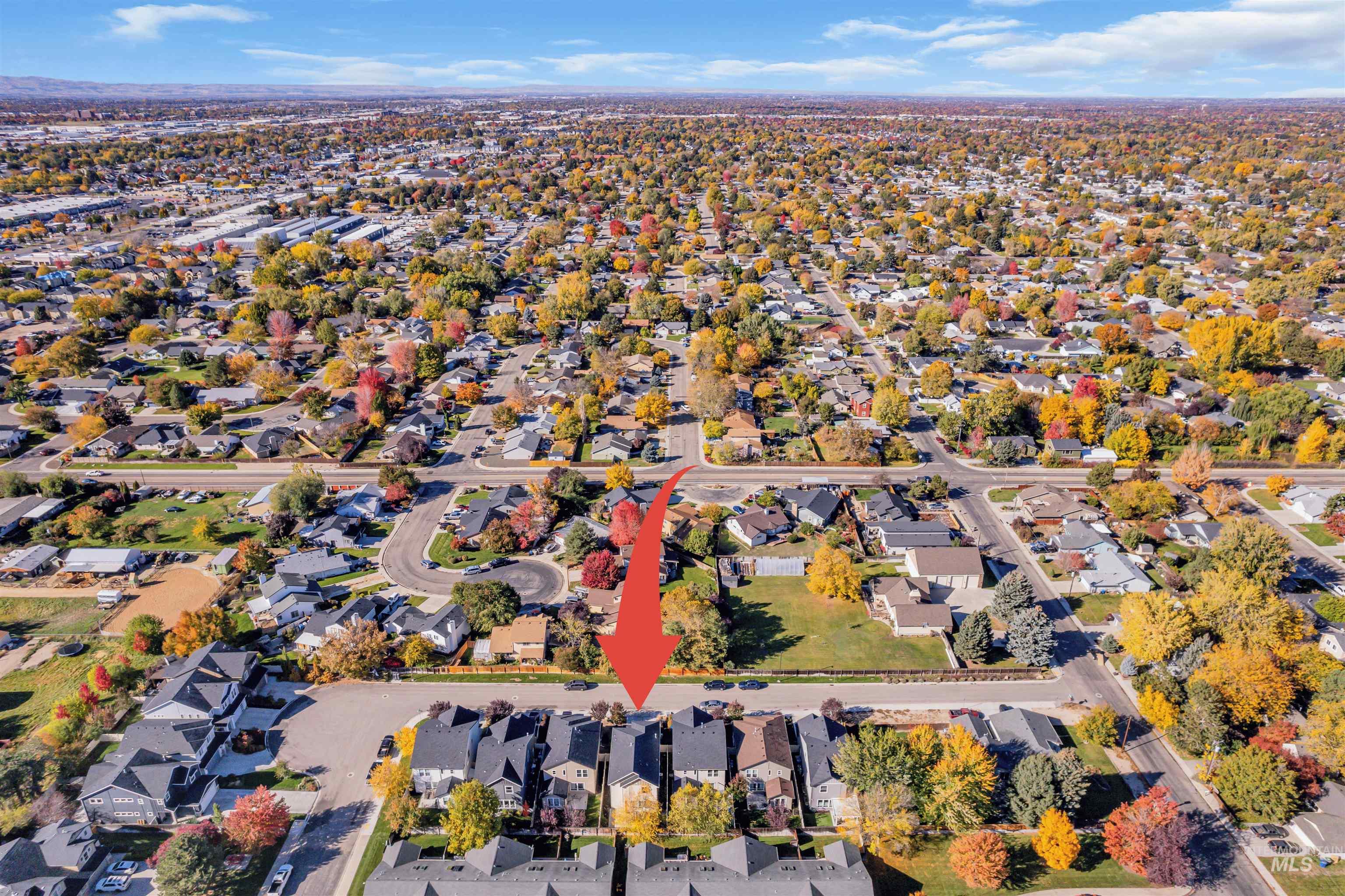 Aerial overview of property's location with nearby suburban area