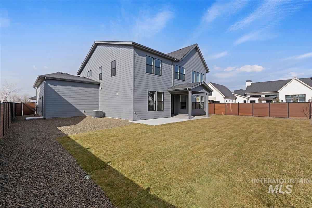 Back of house with a patio and a fenced backyard