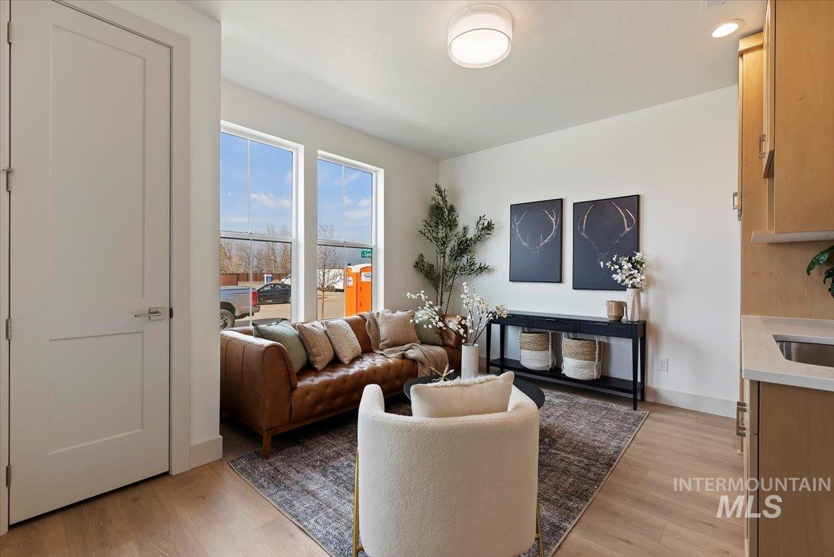 Living room featuring light wood-style flooring