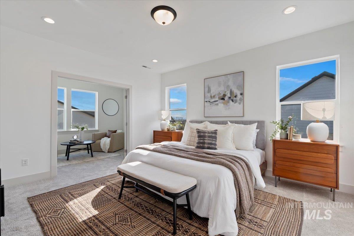 Bedroom featuring light colored carpet and recessed lighting