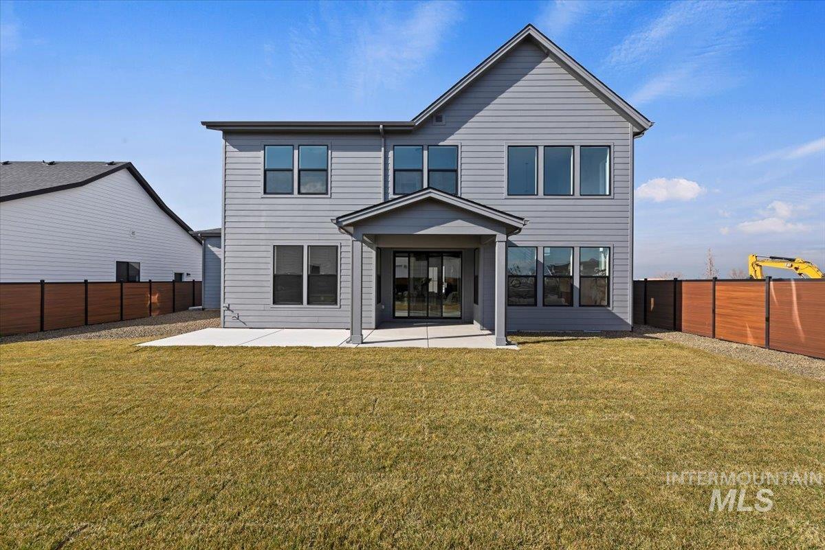 Back of house with a patio and a fenced backyard