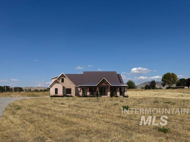 View of front facade featuring a porch and a rural view
