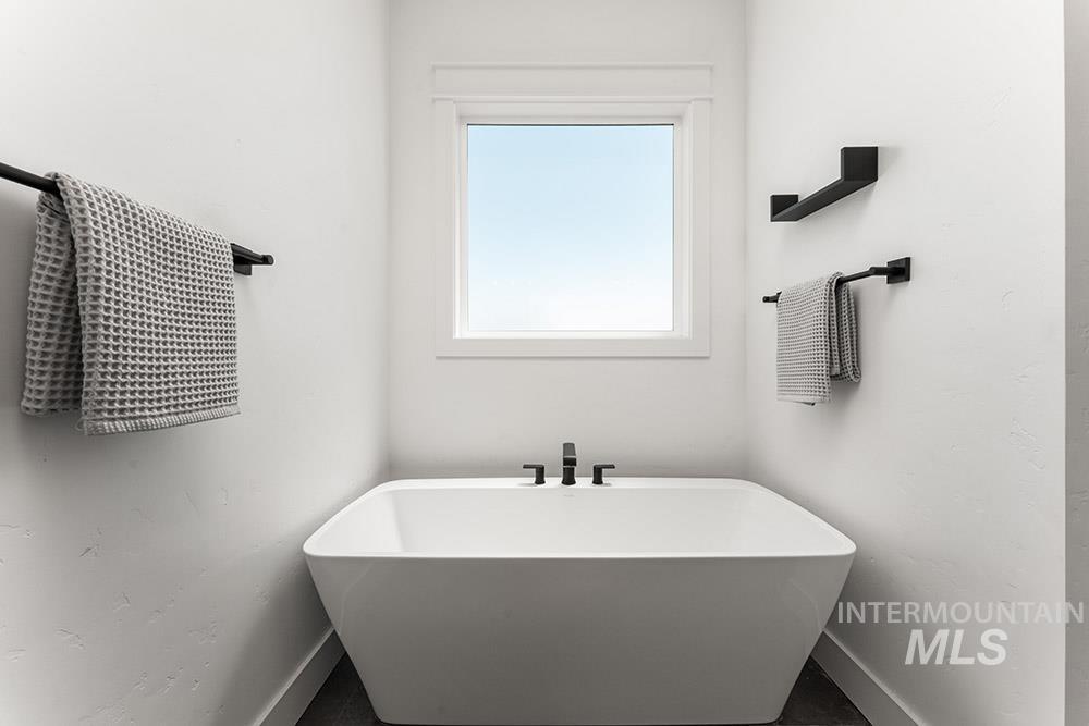 Full bathroom with a soaking tub