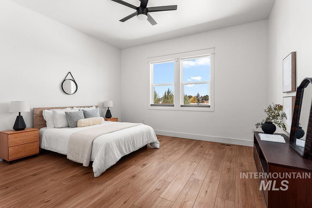 Bedroom featuring light wood-style flooring and ceiling fan