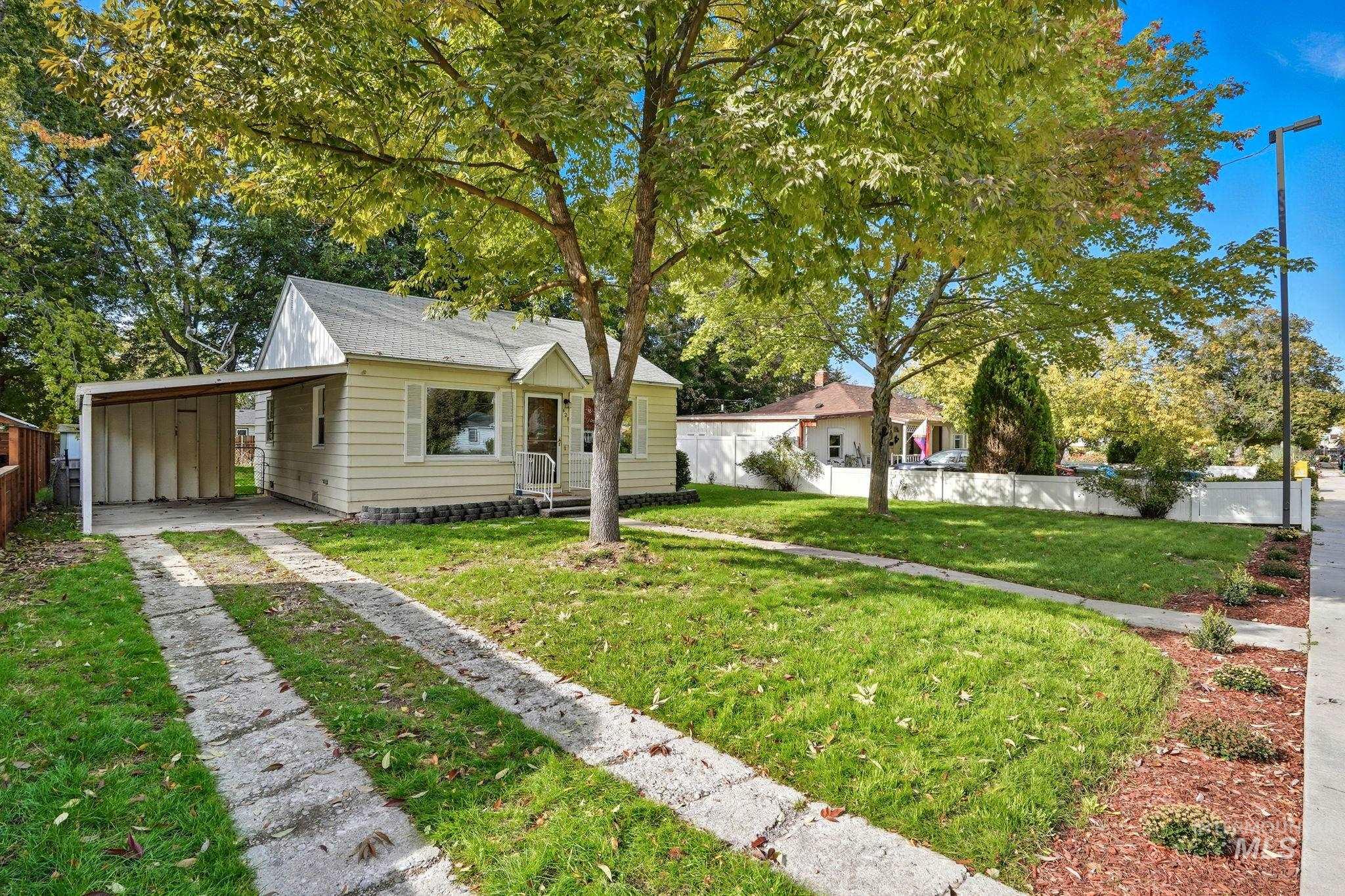 Bungalow-style home featuring a carport