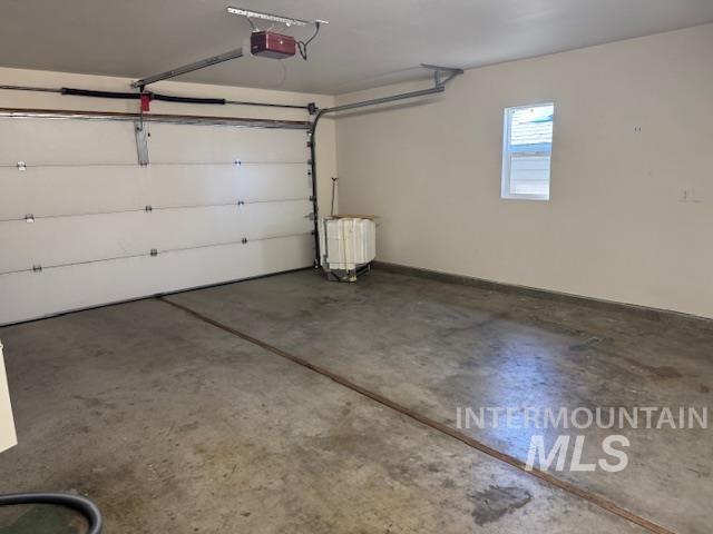 Garage featuring a garage door opener