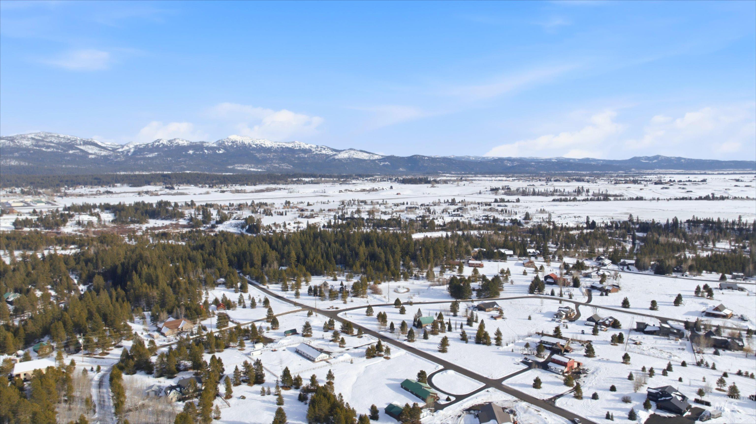 Snowy aerial view with a mountain view