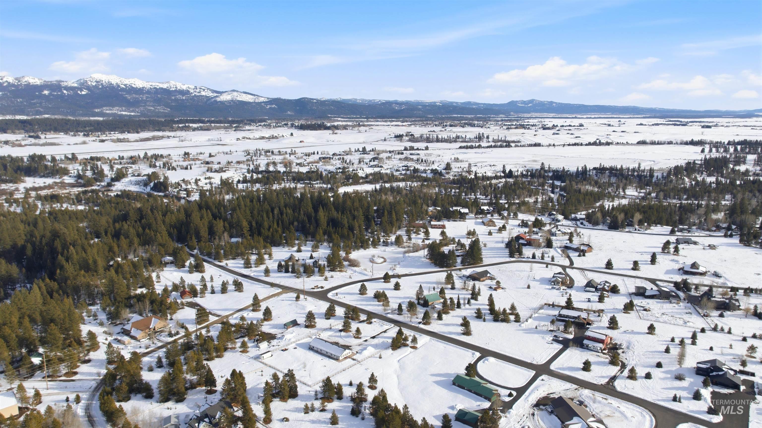 Snowy aerial view with a mountain view
