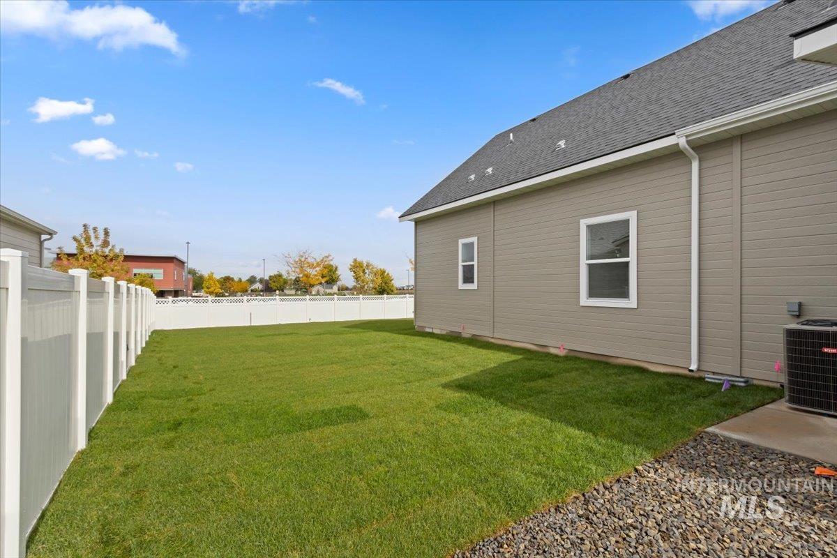 View of fenced backyard