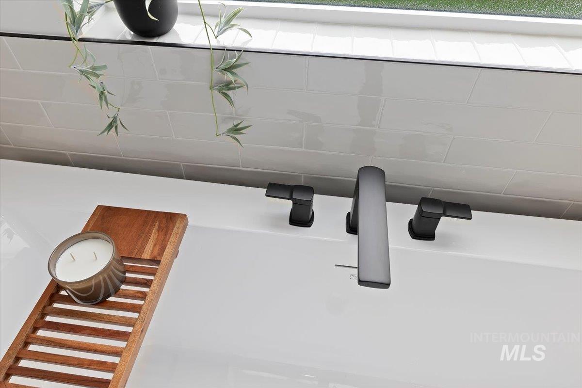 Bathroom view of a bathtub and a sink