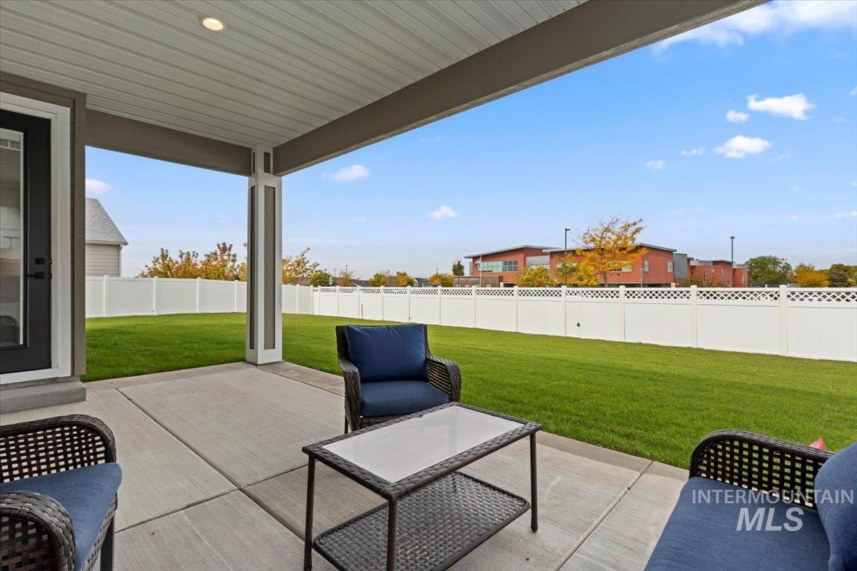 Fenced backyard with a patio area