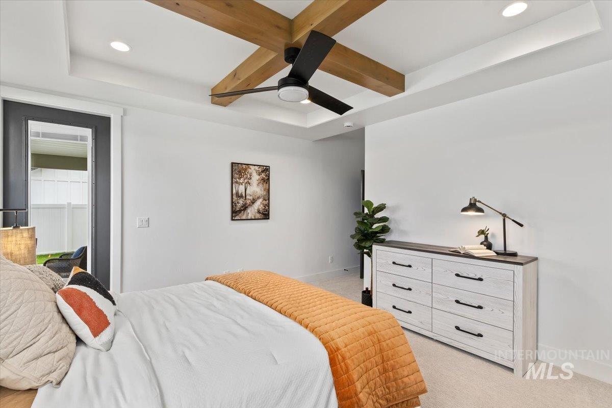 Bedroom featuring beam ceiling, light colored carpet, coffered ceiling, recessed lighting, and a ceiling fan