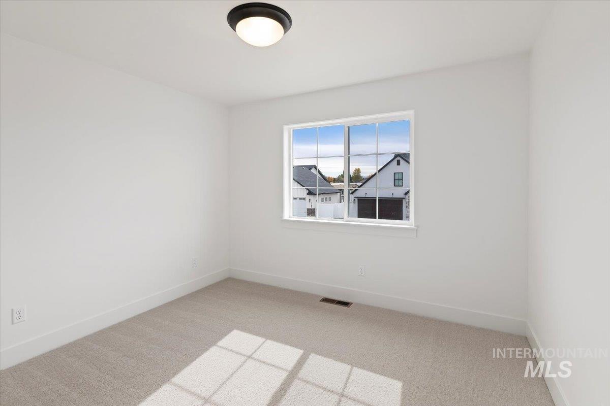 Spare room with light carpet