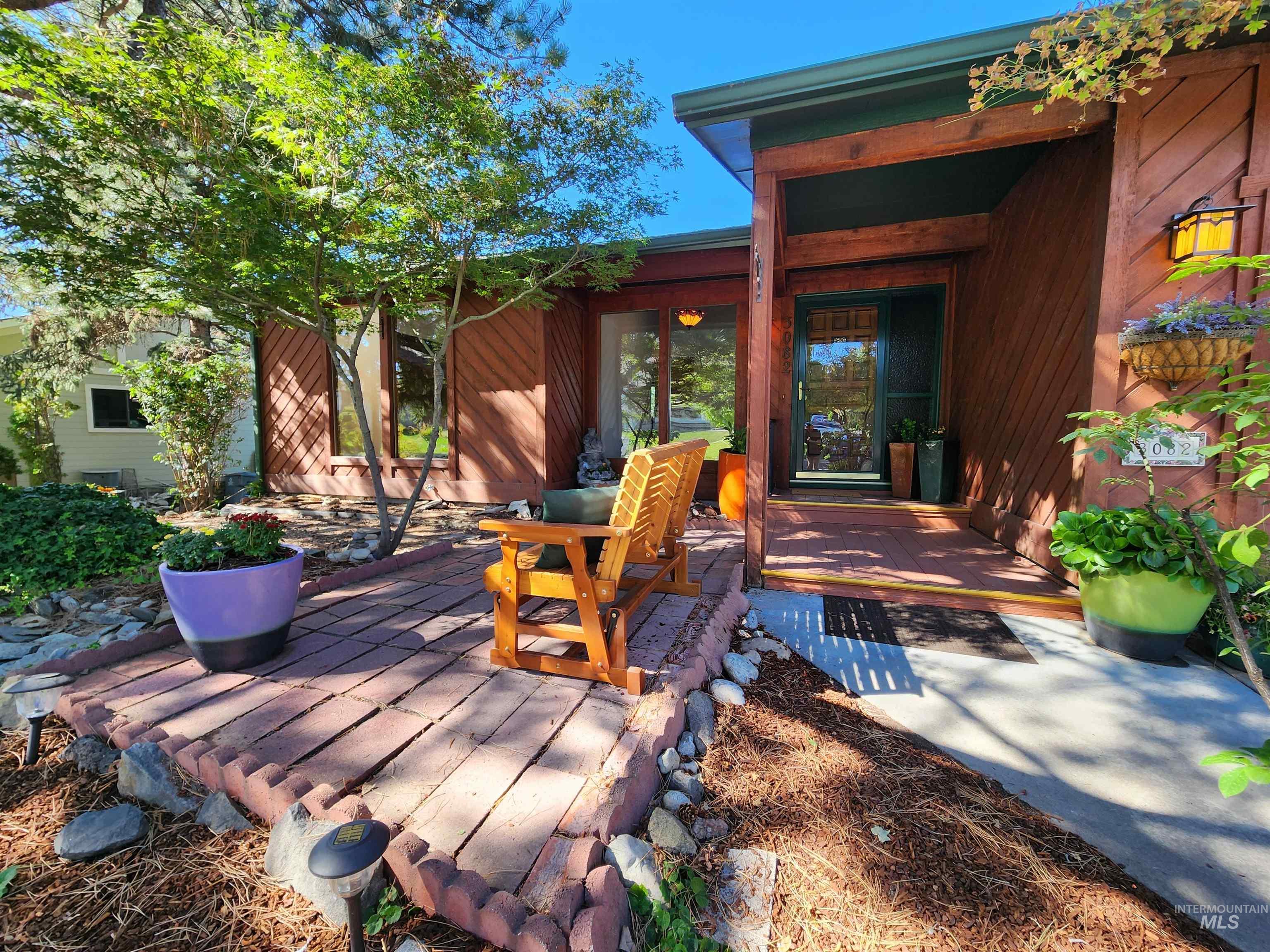 Wooden terrace with a patio area