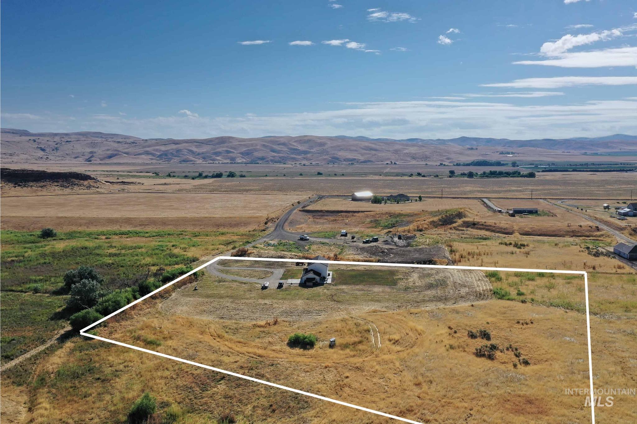 Expansive rural property featuring a single-family residence with an attached garage