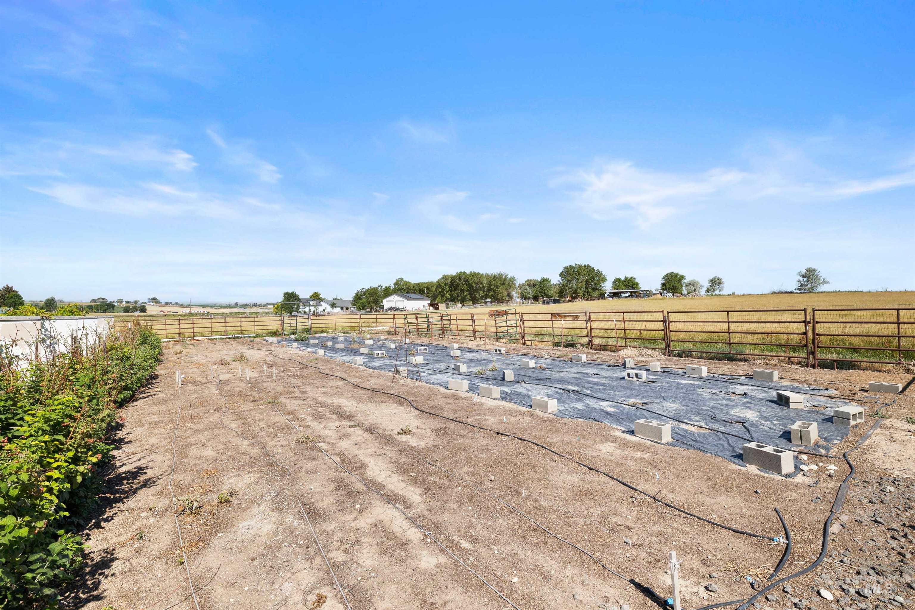 View of yard with a rural view