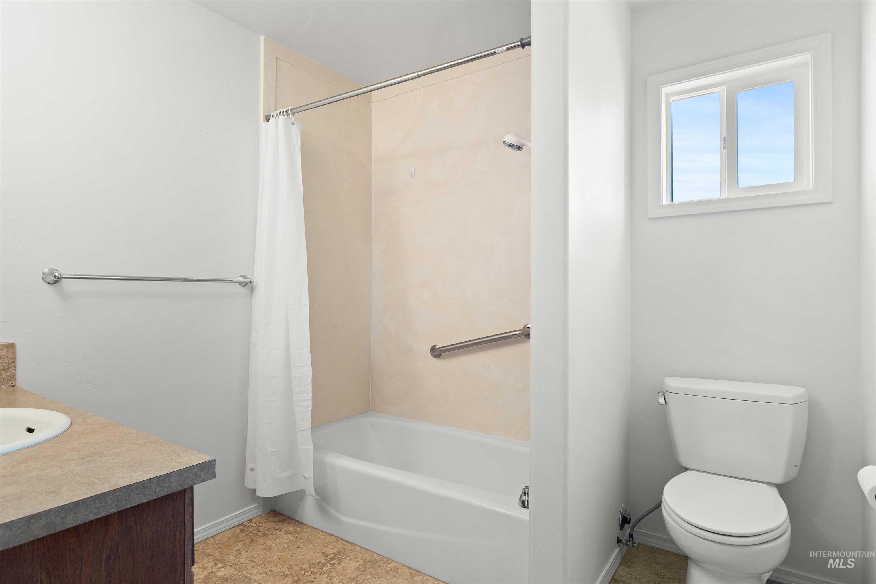 Full bath with shower / bath combo and vanity