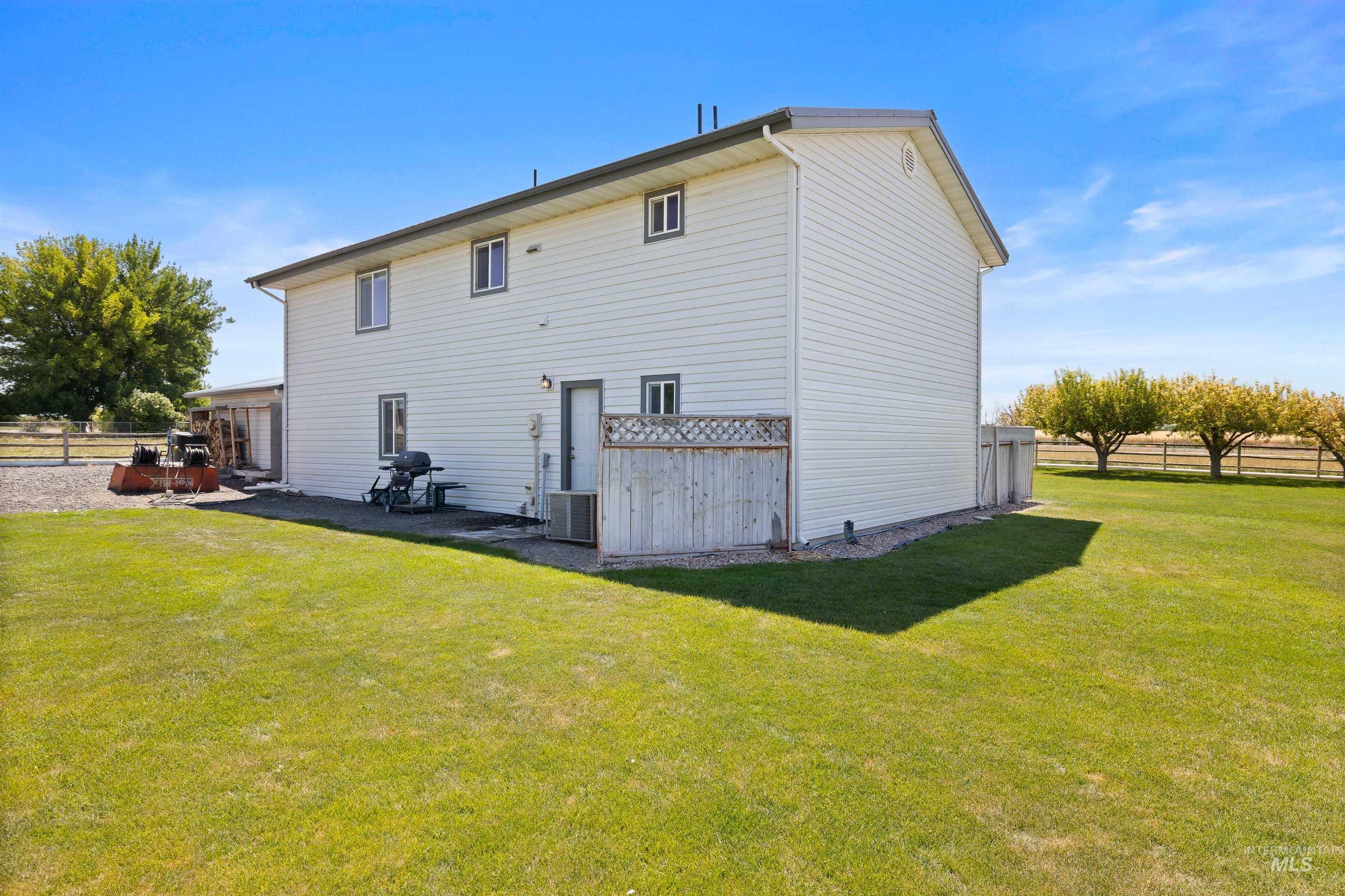 Rear view of property featuring a patio