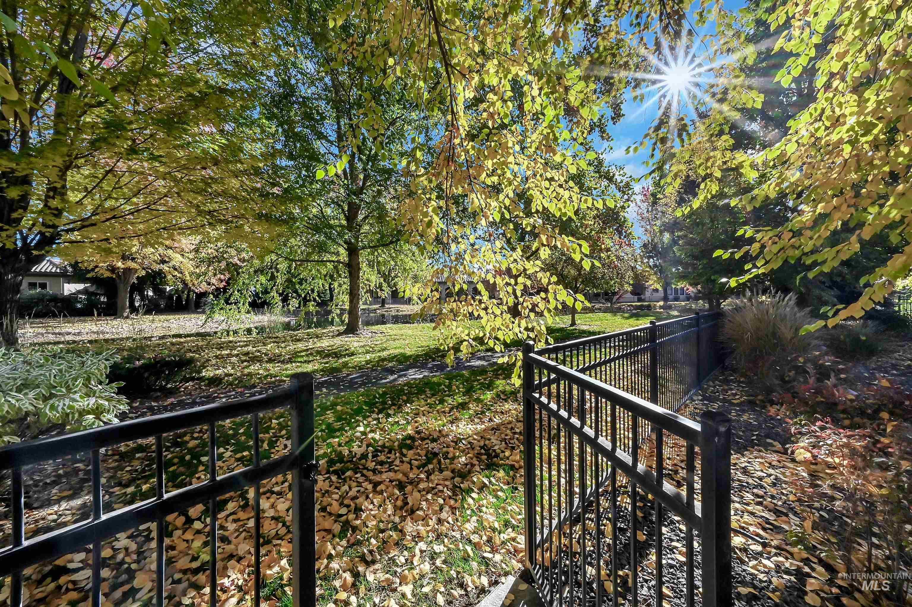 View of yard with a gate and a wooden deck