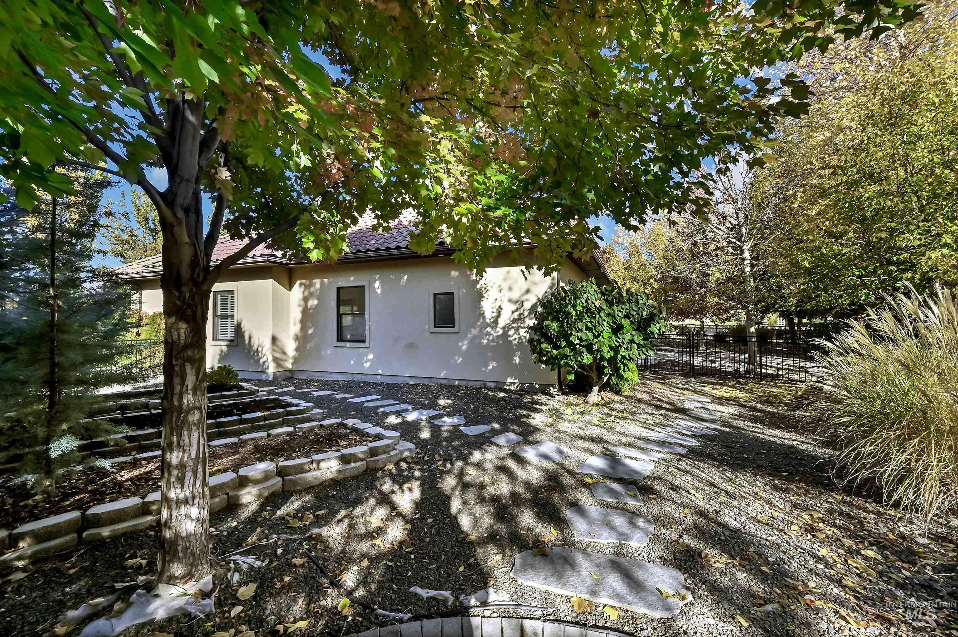 Back of property featuring stucco siding