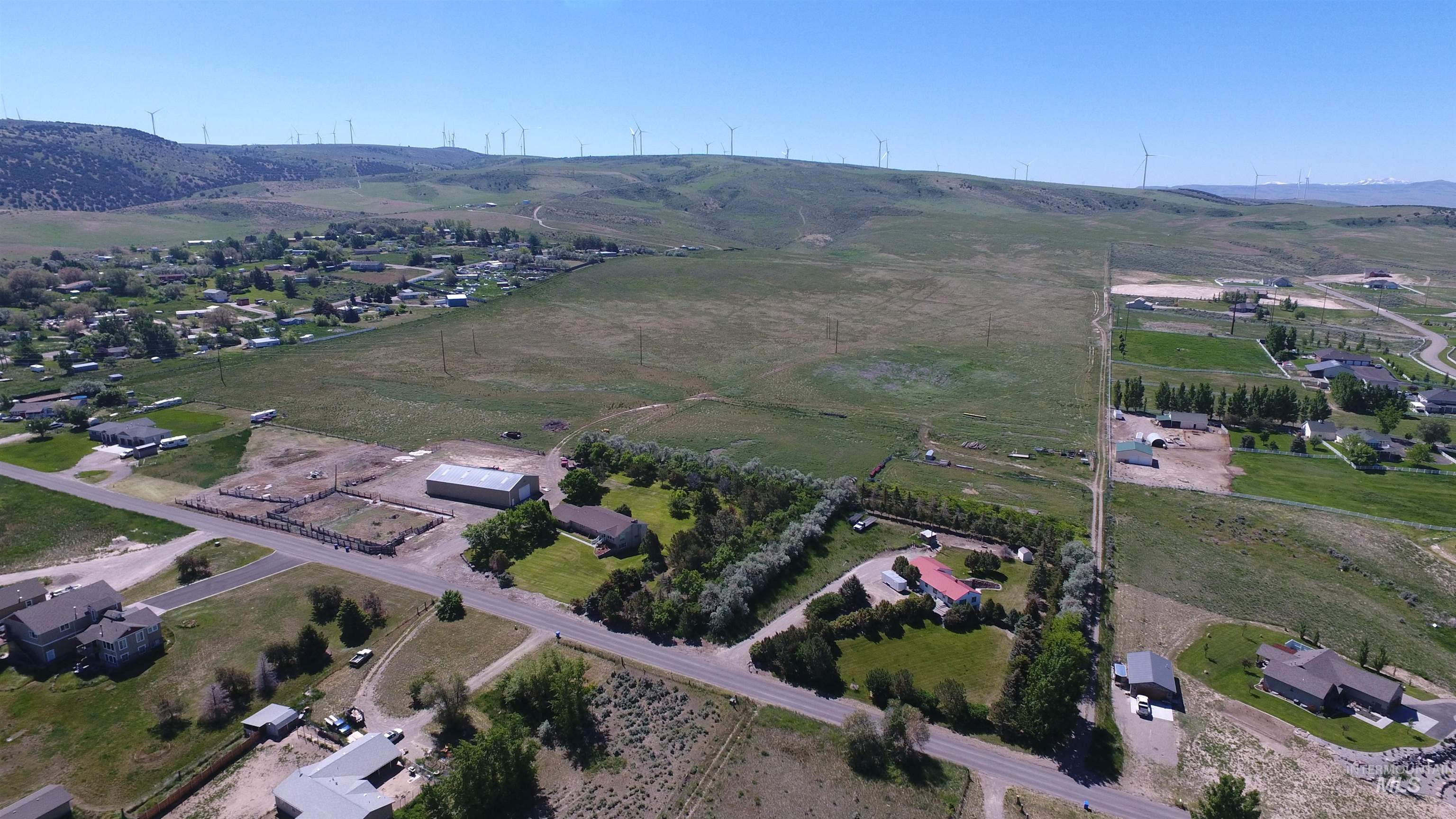 Aerial view of property and surrounding area featuring rural landscape