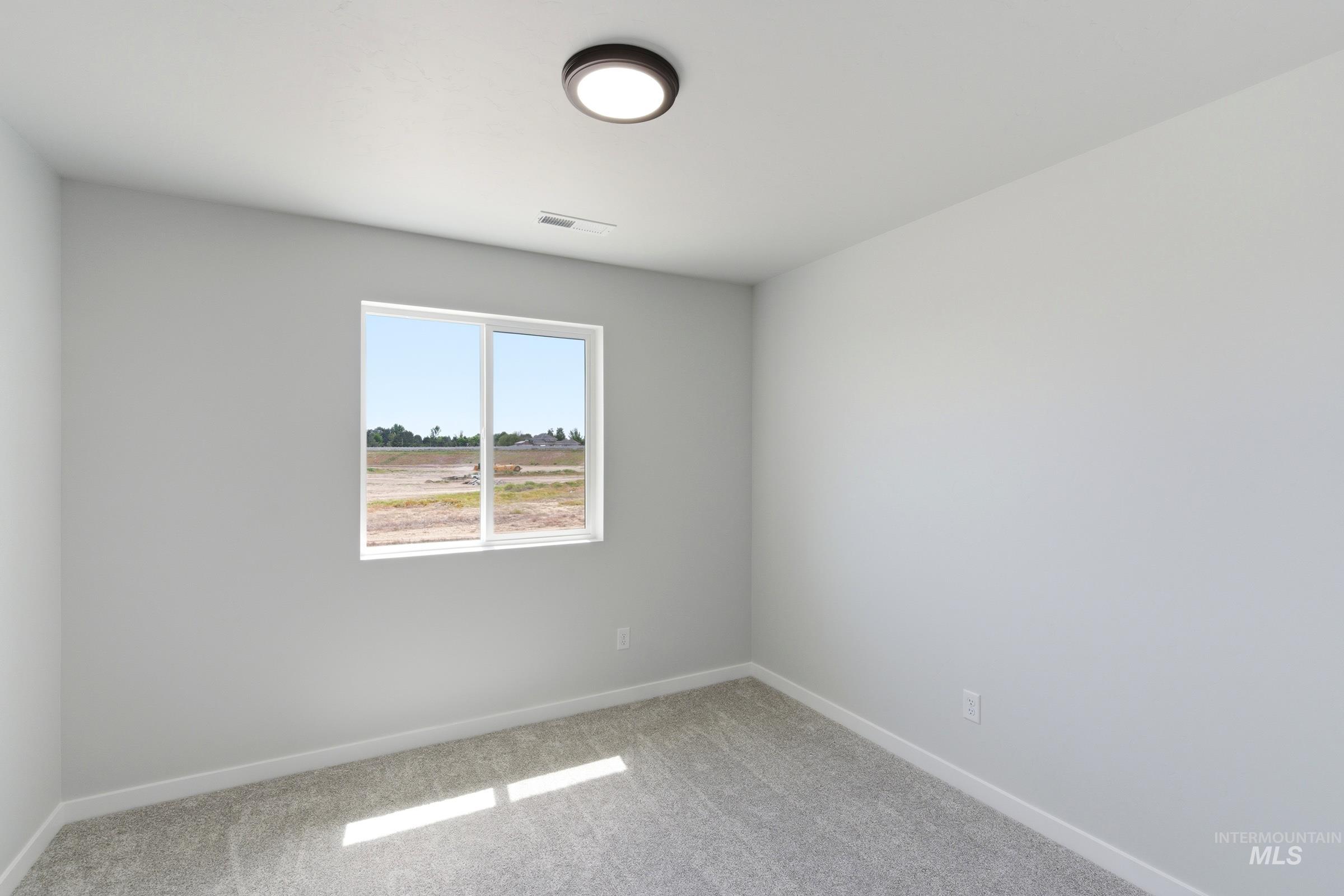 Light gray walls complemented by gray carpet flooring