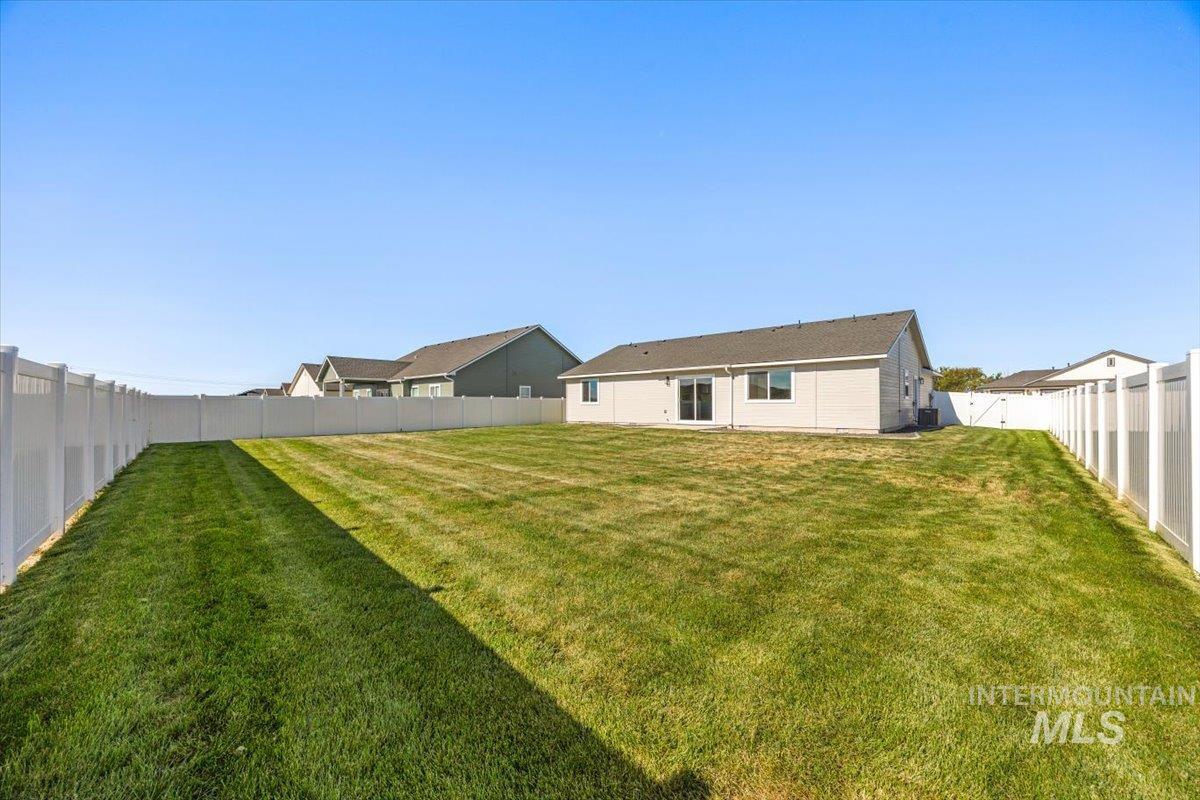 View of fenced backyard