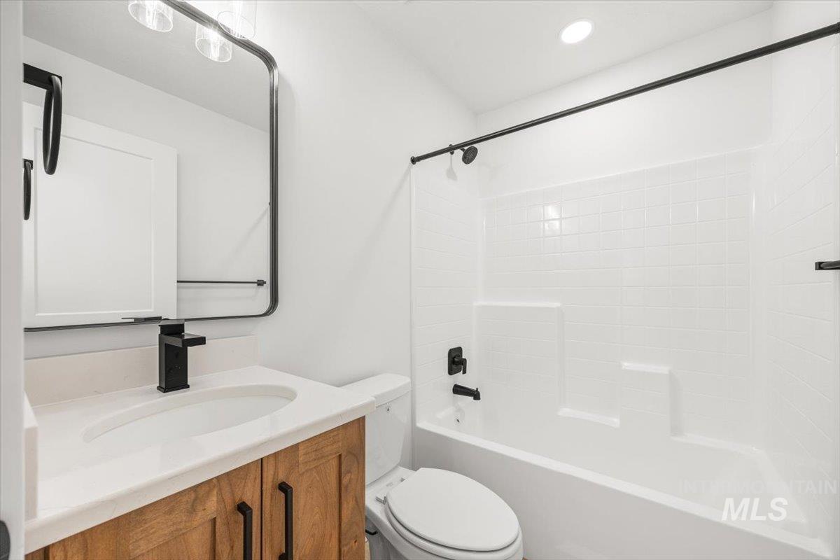 Full bathroom featuring shower / washtub combination and vanity