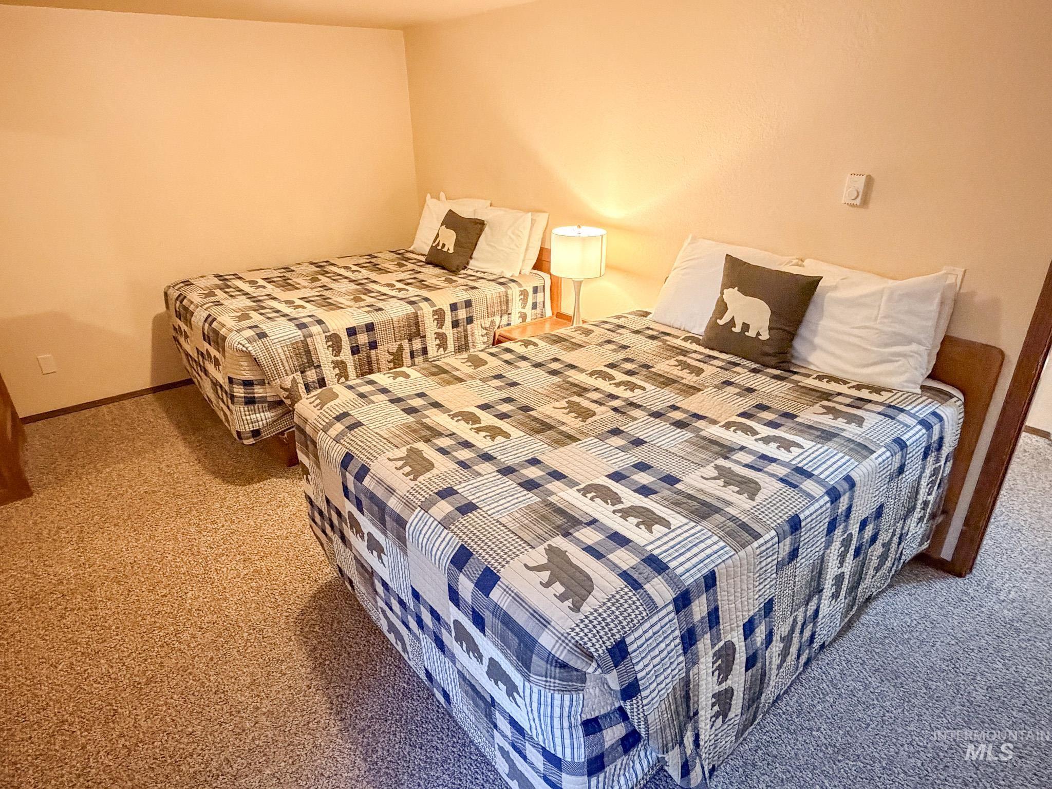 Carpeted bedroom featuring baseboards