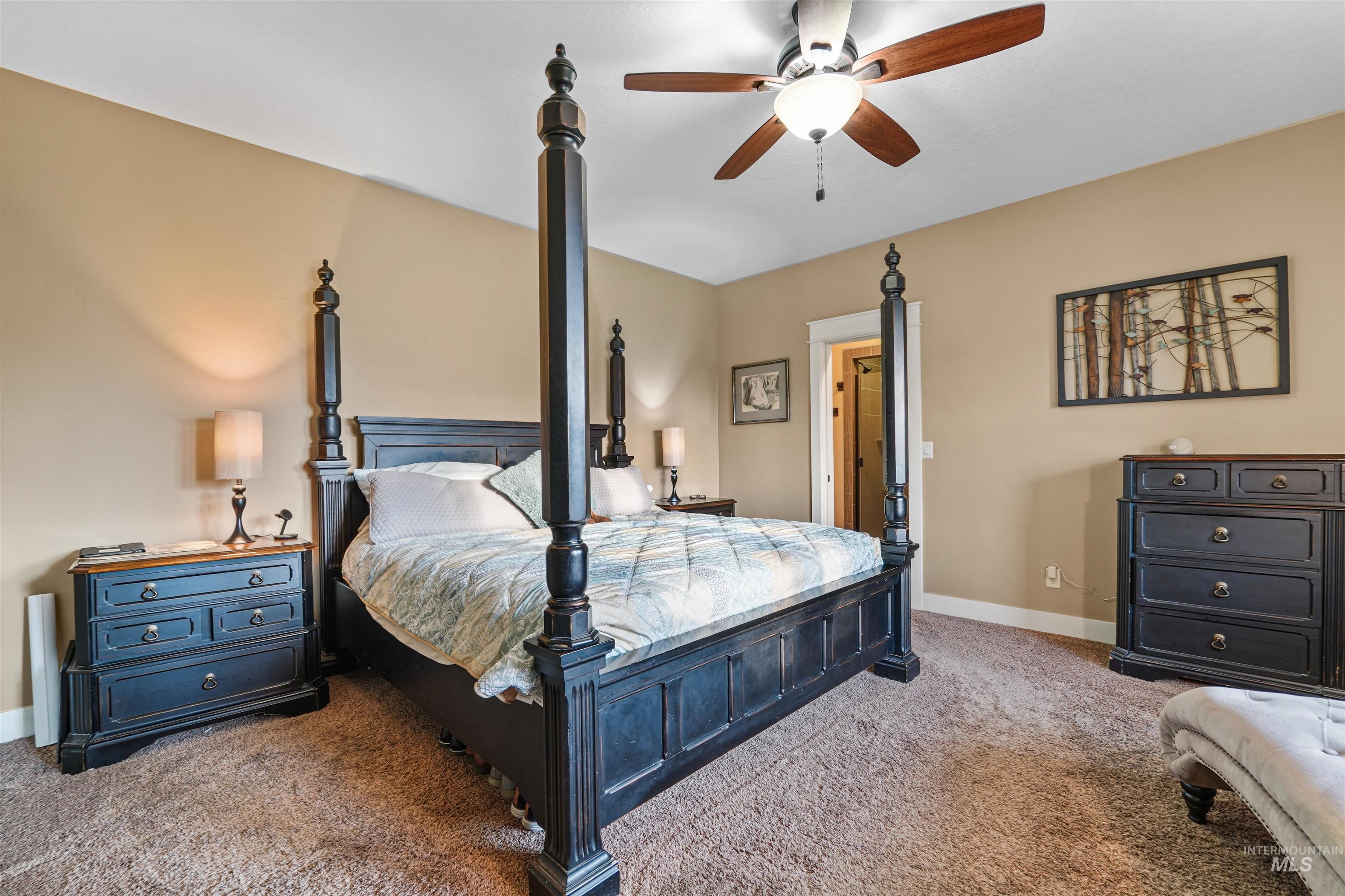 Bedroom with carpet flooring and a ceiling fan